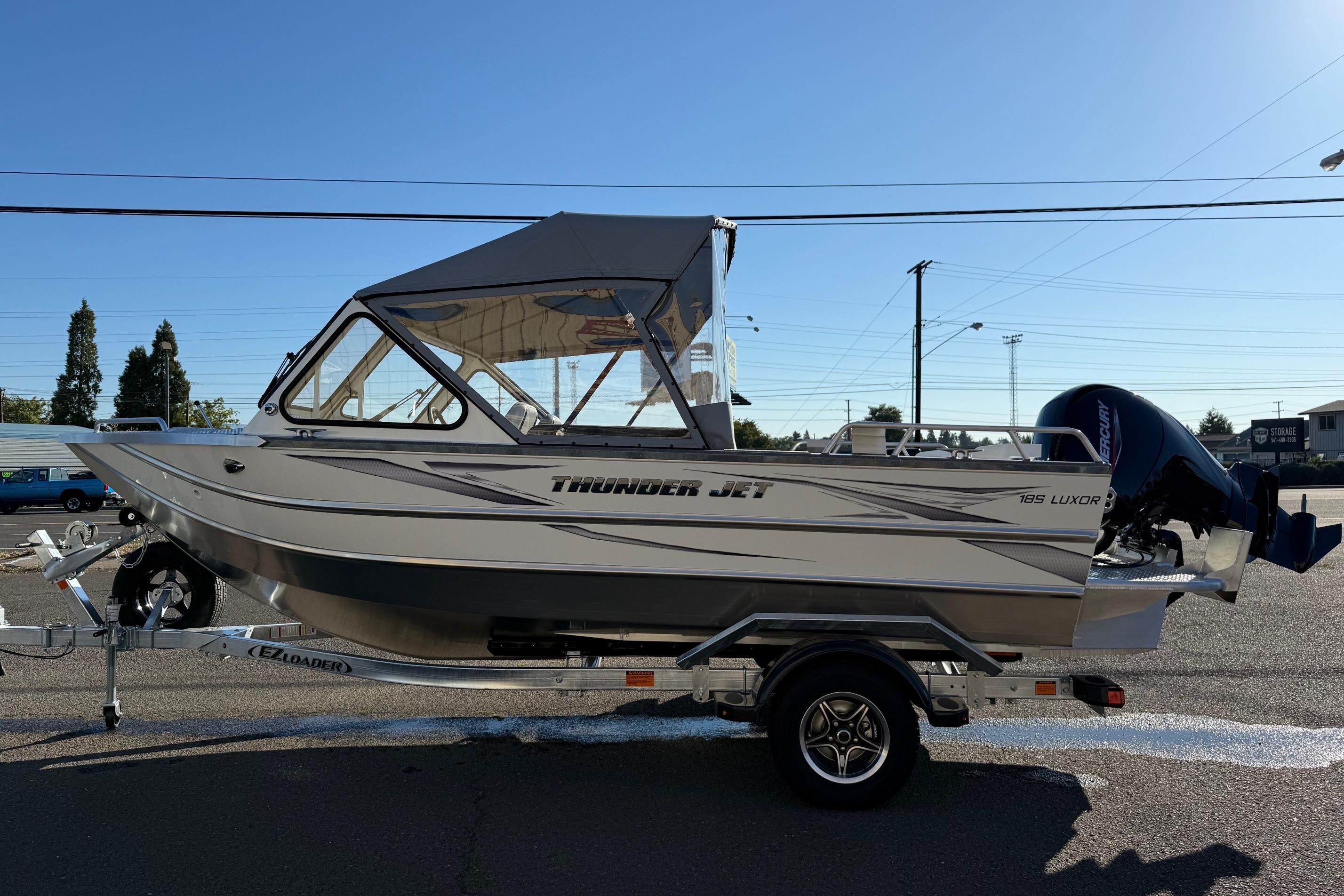 2026 Thunder Jet 185 Luxor boat on trailer, side view under clear sky.