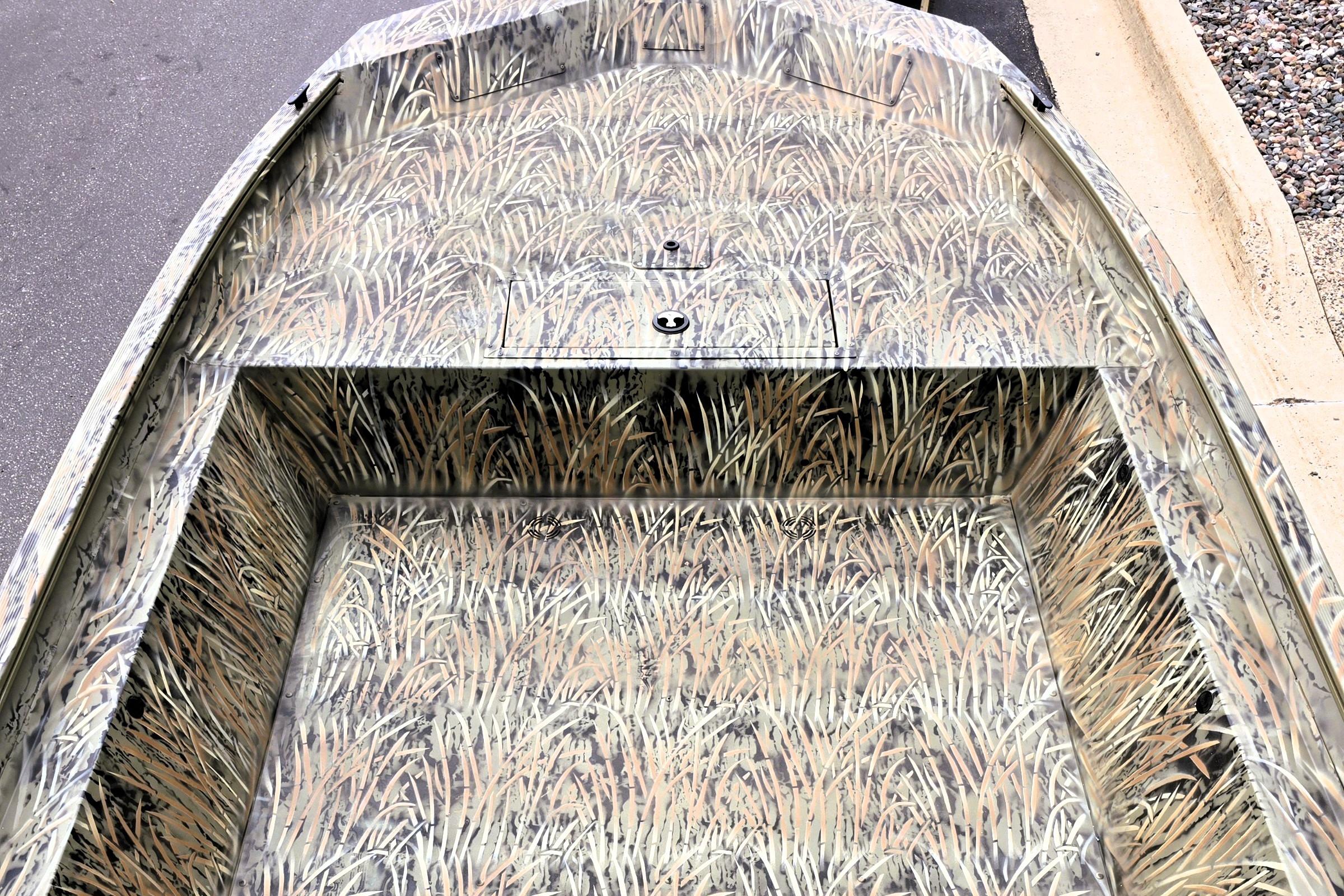 2026 Tracker GRIZZLY 1860 Utility boat with camouflage interior design.