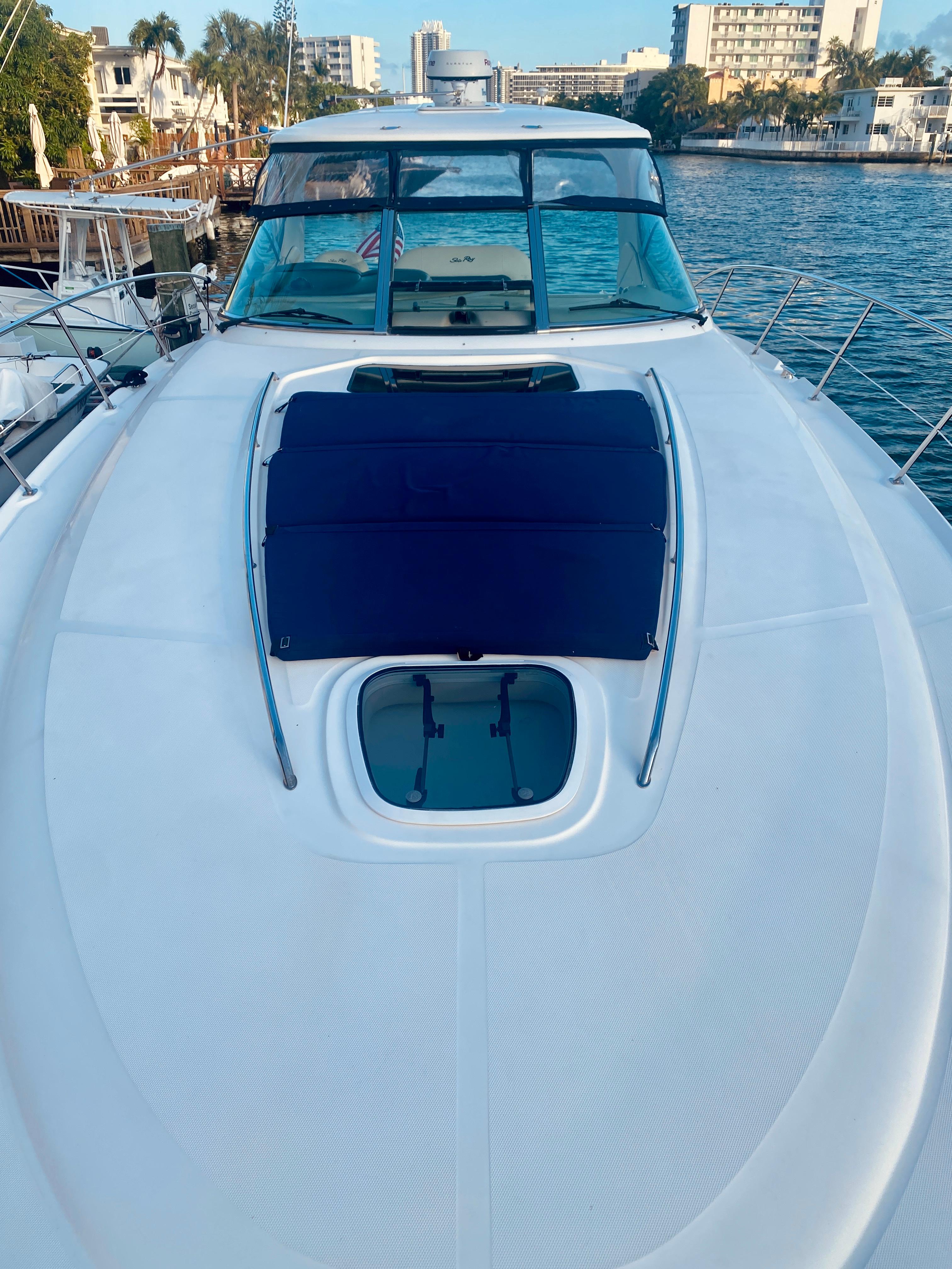 2005 Sea Ray 420 Sundancer yacht docked in a marina.