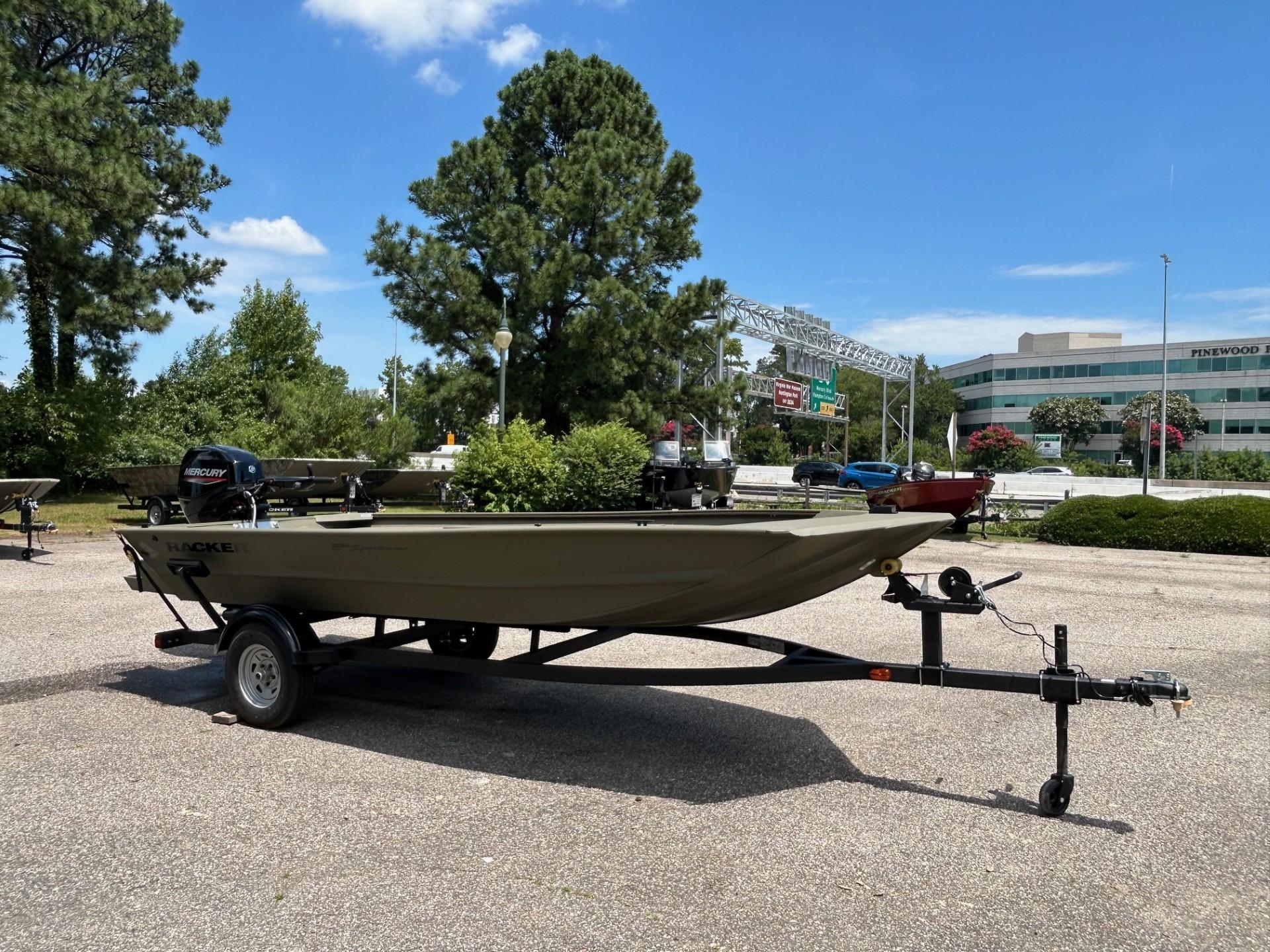 2025 Tracker Grizzly 1654 T Sportsman boat on trailer in sunny outdoor setting.