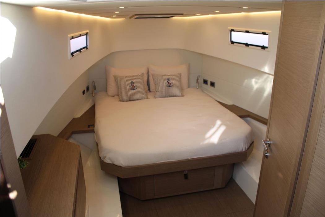 Luxurious cabin interior of 2025 Pardo Yachts P38, featuring a cozy bed and modern design.
