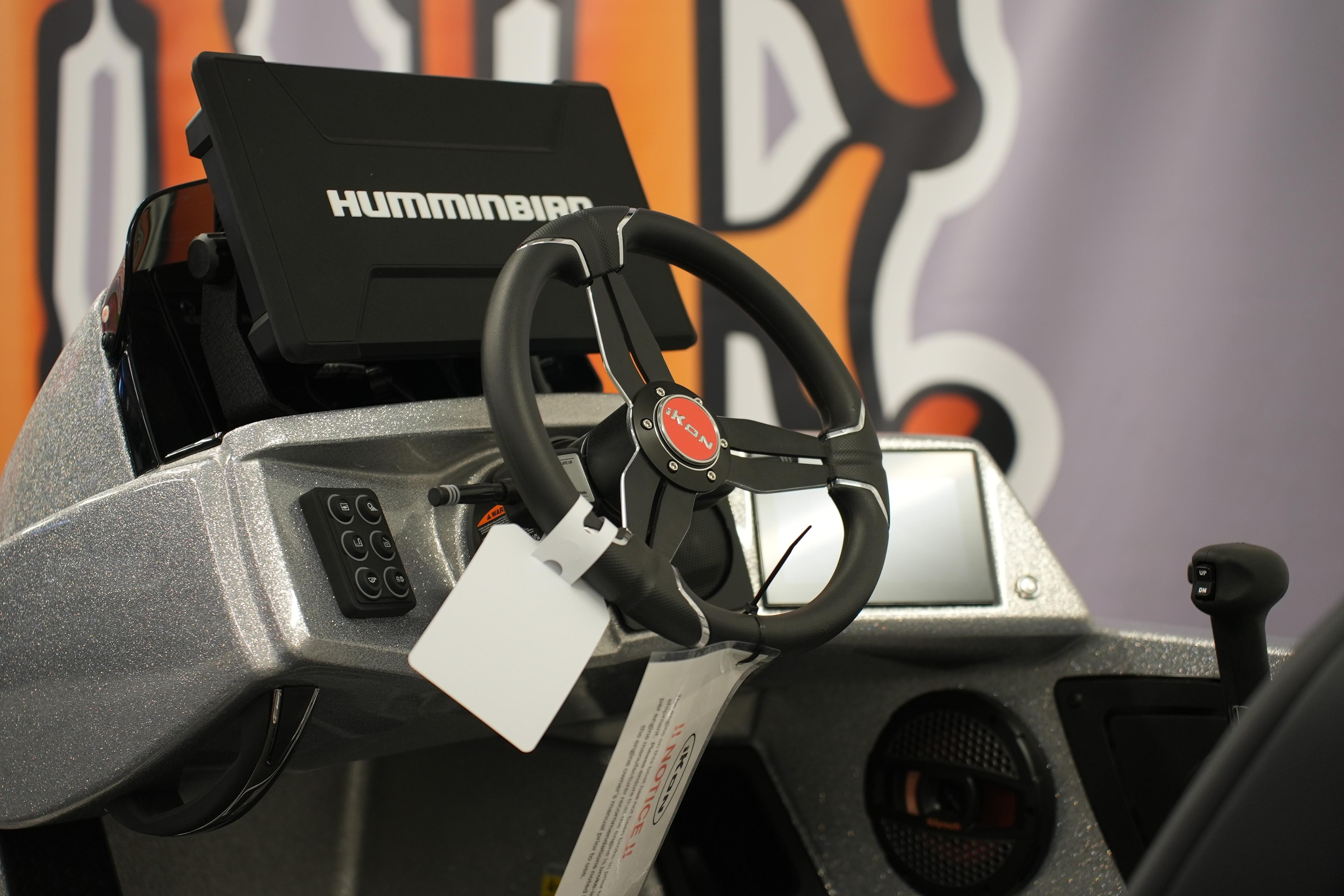 Steering wheel and dashboard of 2026 iKon LXE20 boat with Humminbird display.