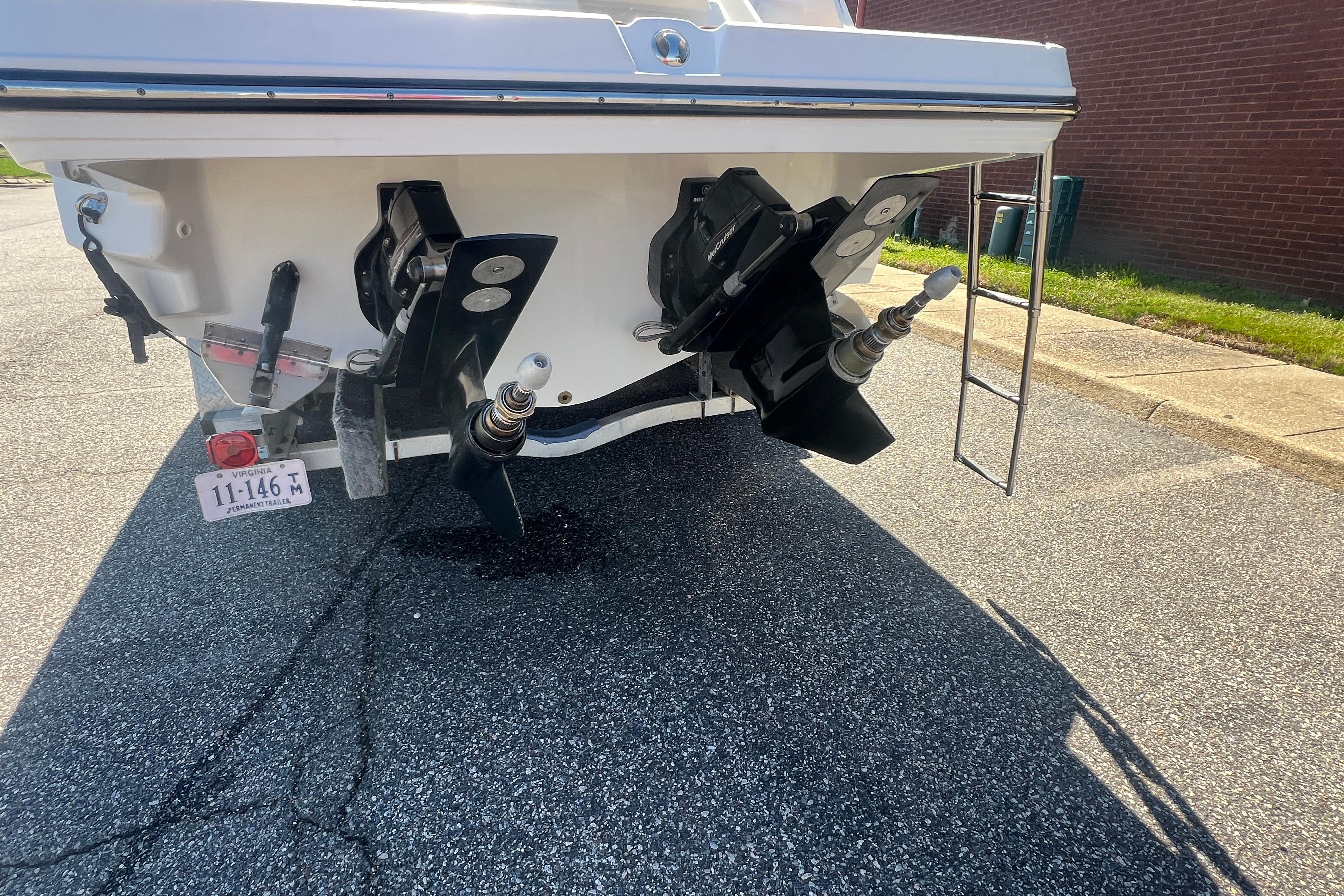 2017 Monterey 298SS Super Sport boat stern with dual propellers and ladder.