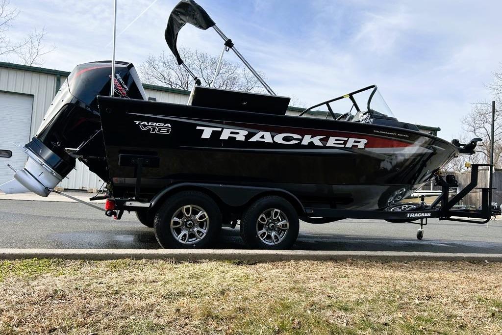 2026 Tracker Targa V-18 Combo boat on trailer, parked outdoors.