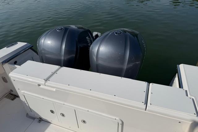 2014 Southport 29 FE boat with dual outboard engines on calm water.