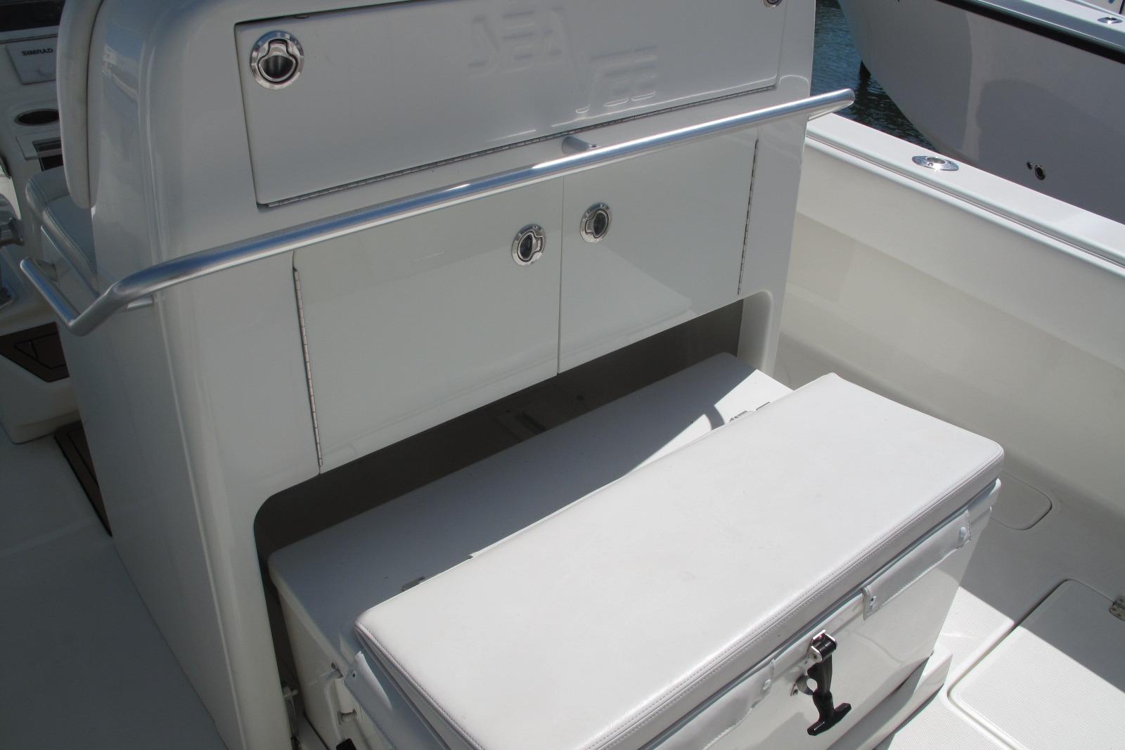 2017 SeaVee 340B boat interior with storage compartment and cushioned seating.
