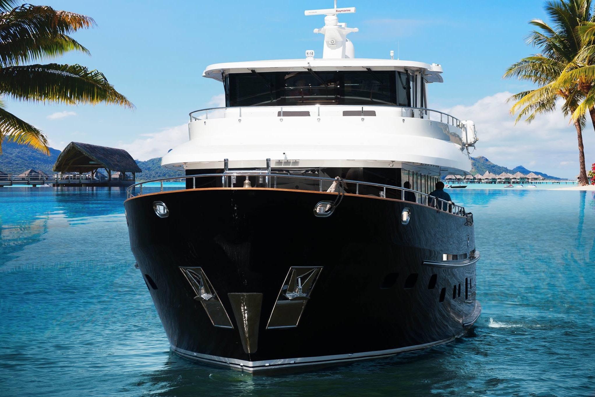 Luxurious 2014 Fifth Ocean Yachts 24m Explorer Yacht in tropical paradise setting.