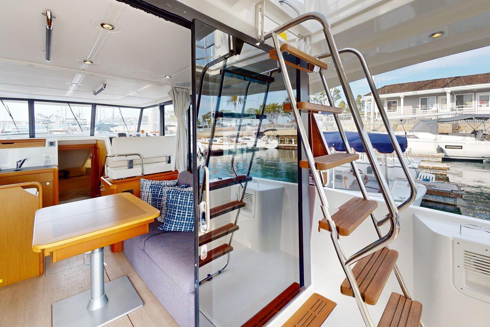Interior of 2021 Beneteau Swift Trawler 35 with modern design and marina view.