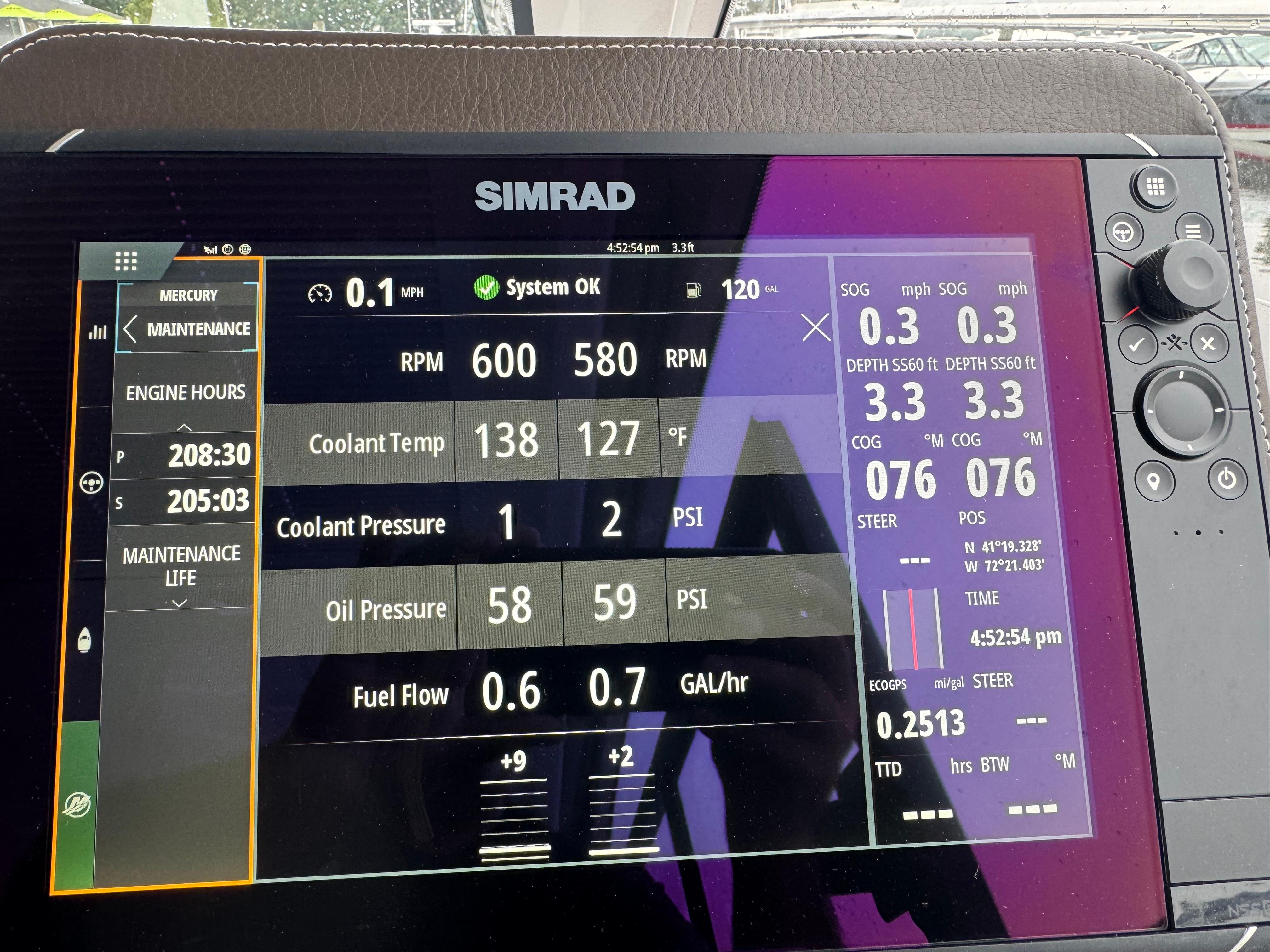 Simrad display on 2020 Four Winns Vista 355 Coupe OB showing engine and navigation data.