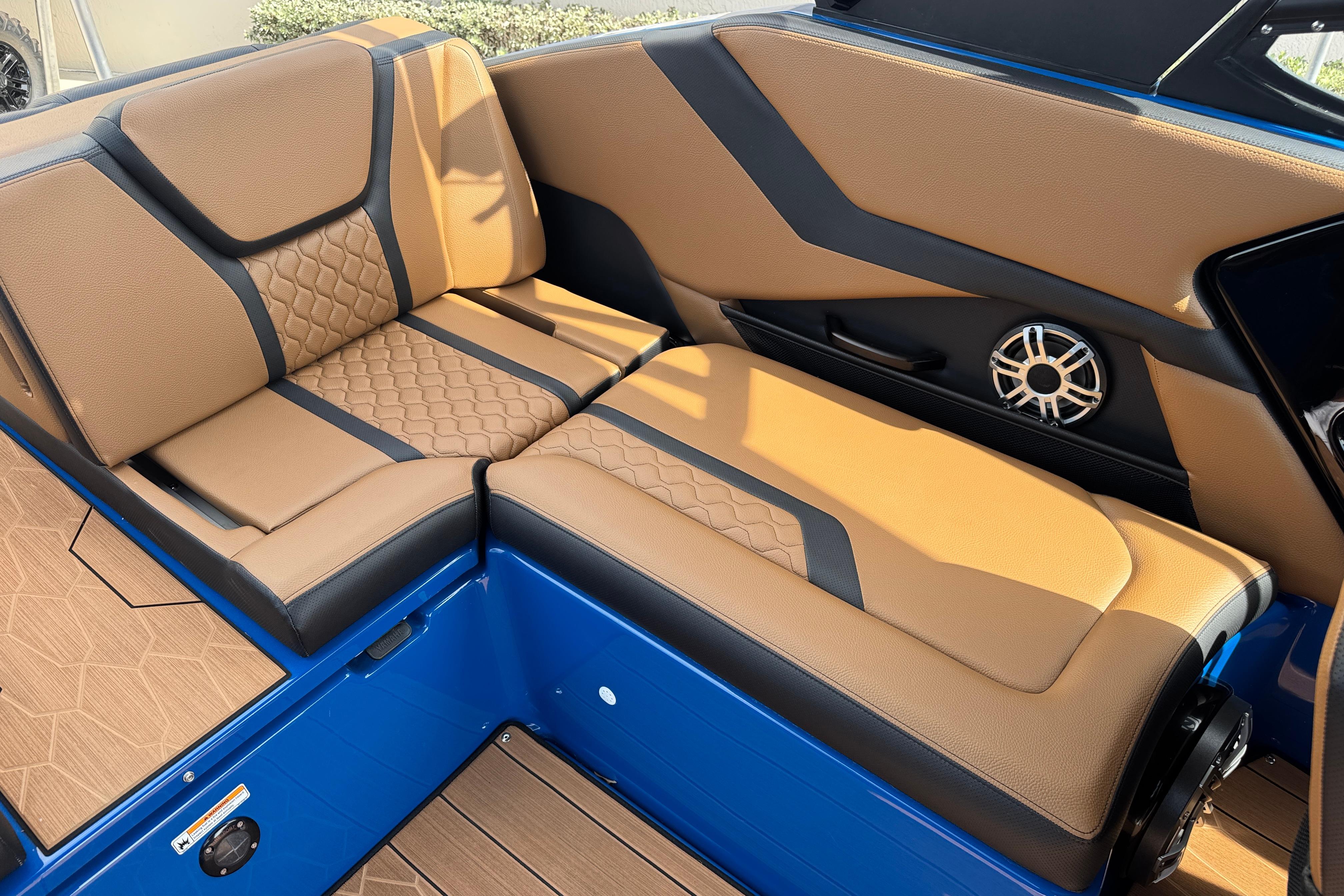 Luxurious interior seating of 2026 Yamaha Boats 255XD with tan and black upholstery.