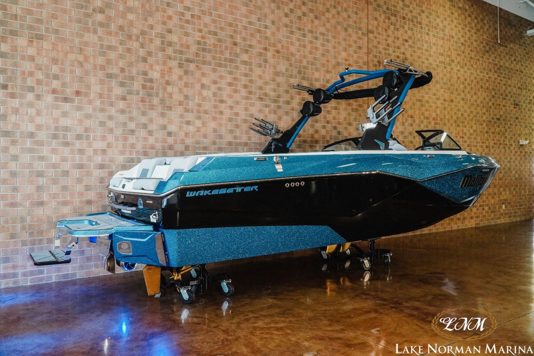 2023 Malibu Wakesetter 25 LSV boat displayed indoors at Lake Norman Marina.