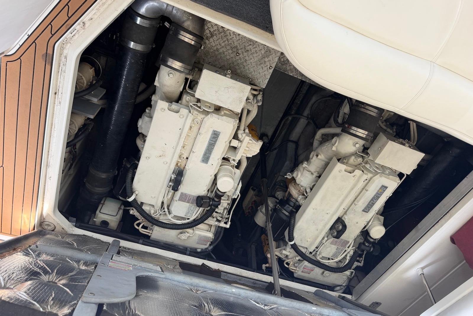 Engine compartment of a 2000 Sea Ray 410 Sundancer boat, showcasing dual engines.