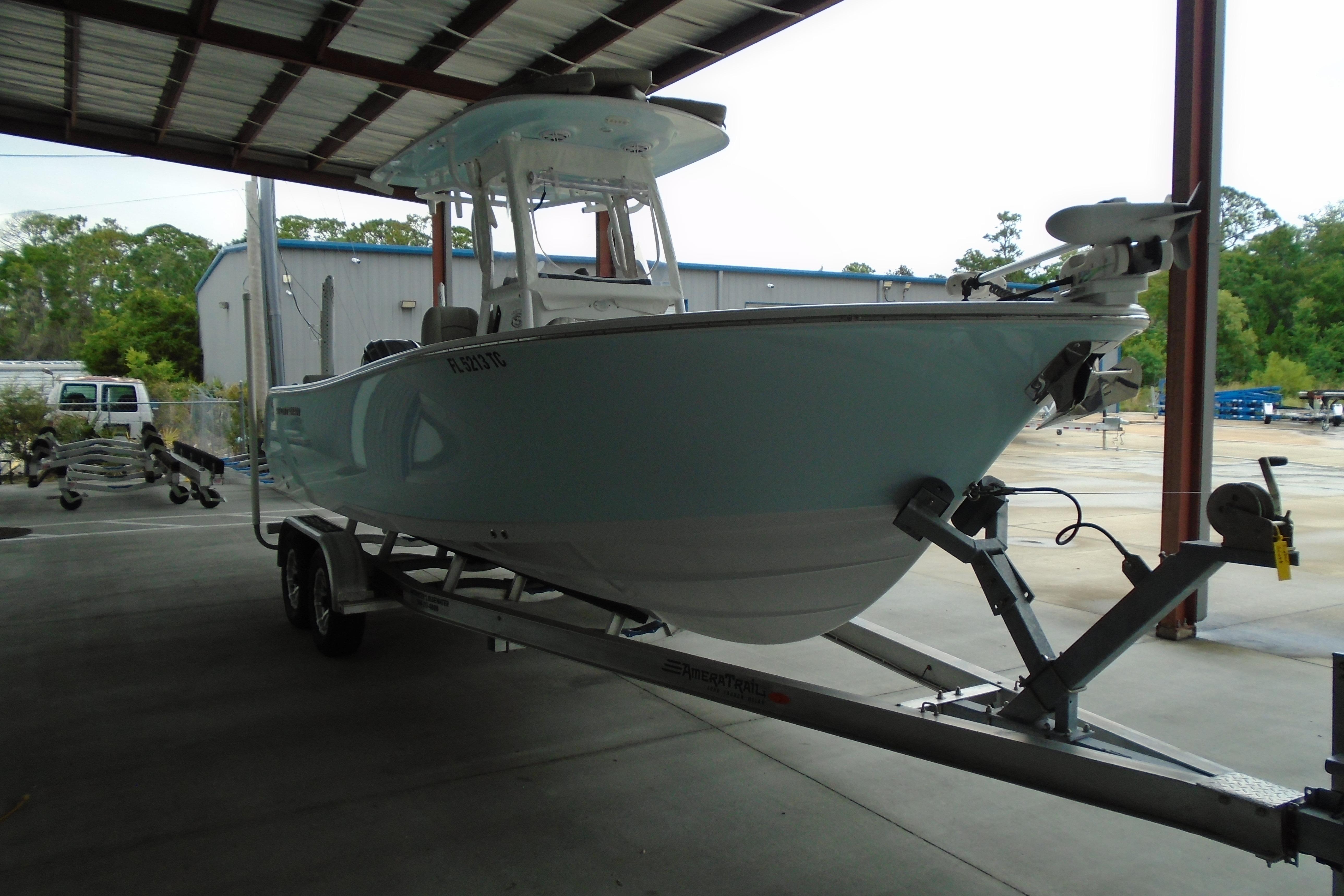 2022 Sportsman Heritage 241 Center Console boat on trailer in covered storage.