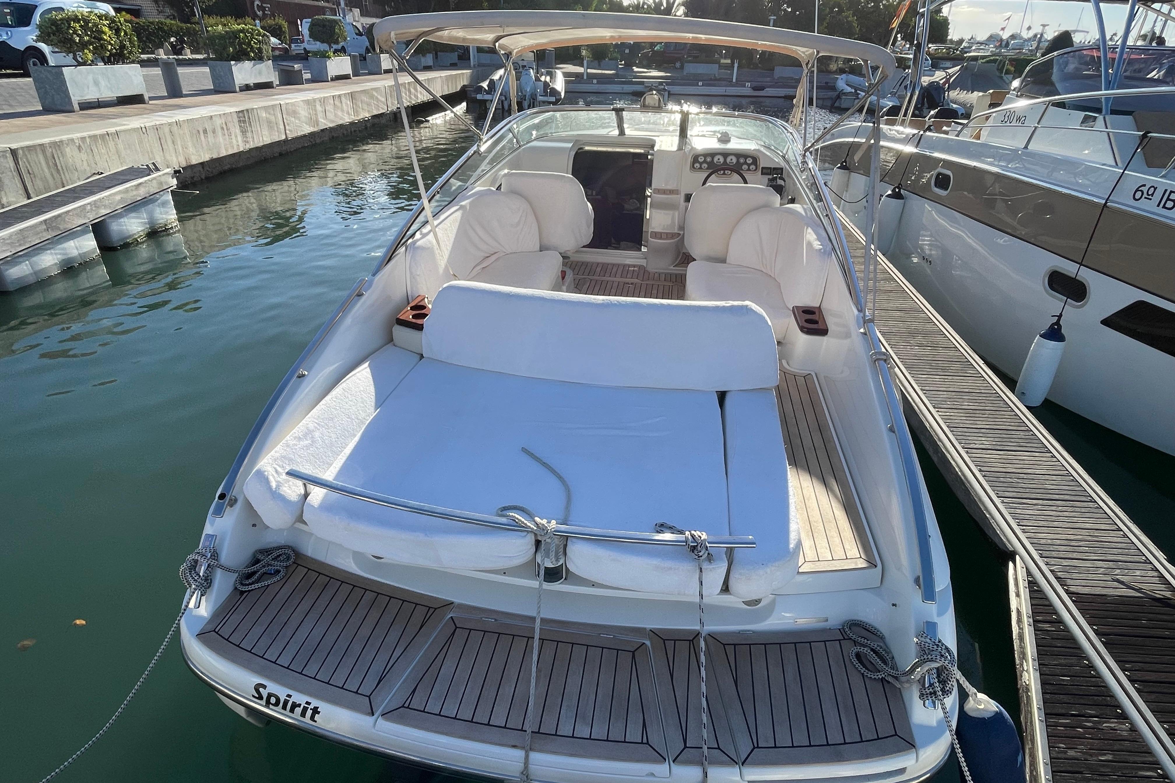 2011 Windy 28 Ghibli boat docked, featuring spacious seating and sleek design.