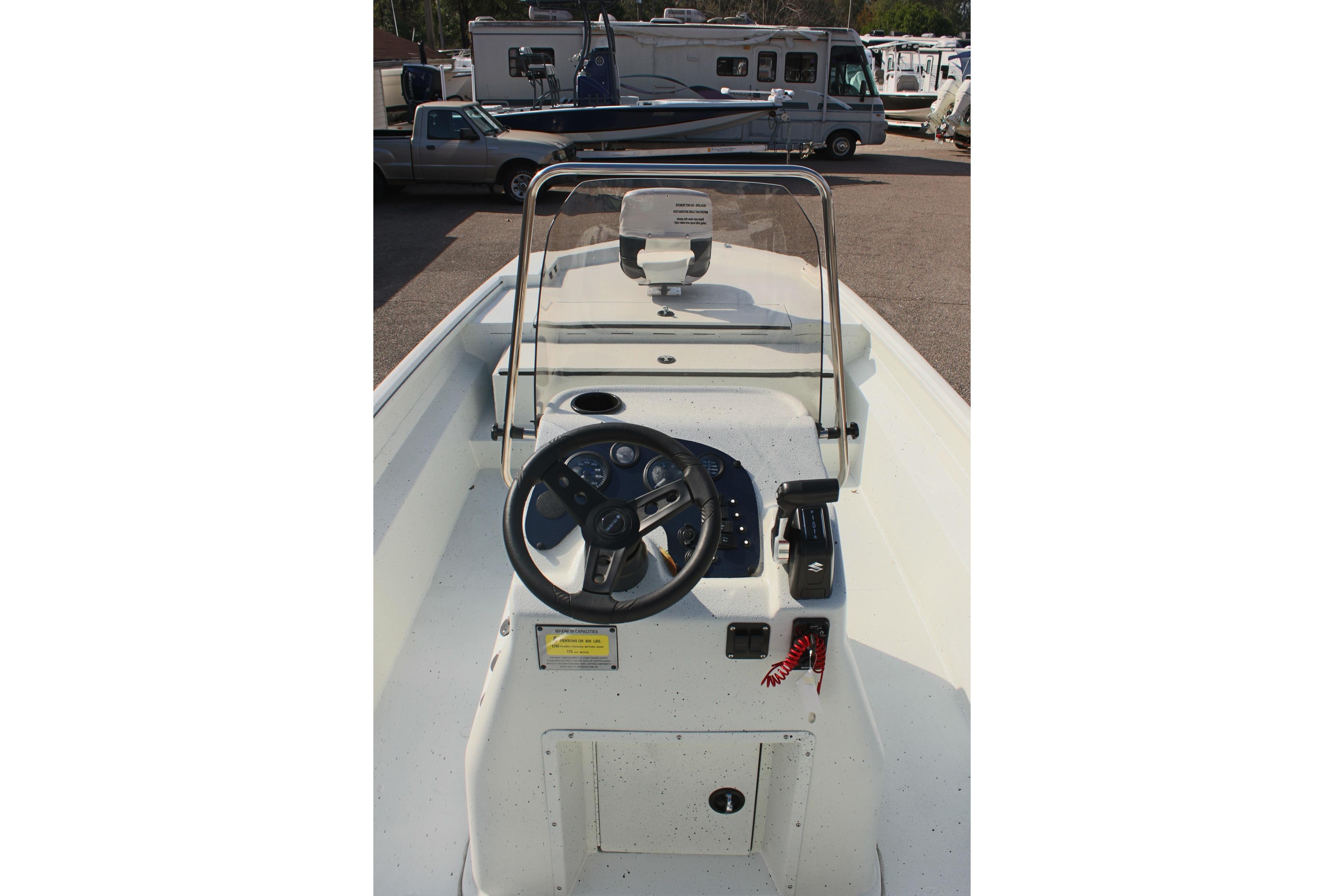 2025 Excel 2172 Stalker CC boat console with steering wheel and controls.
