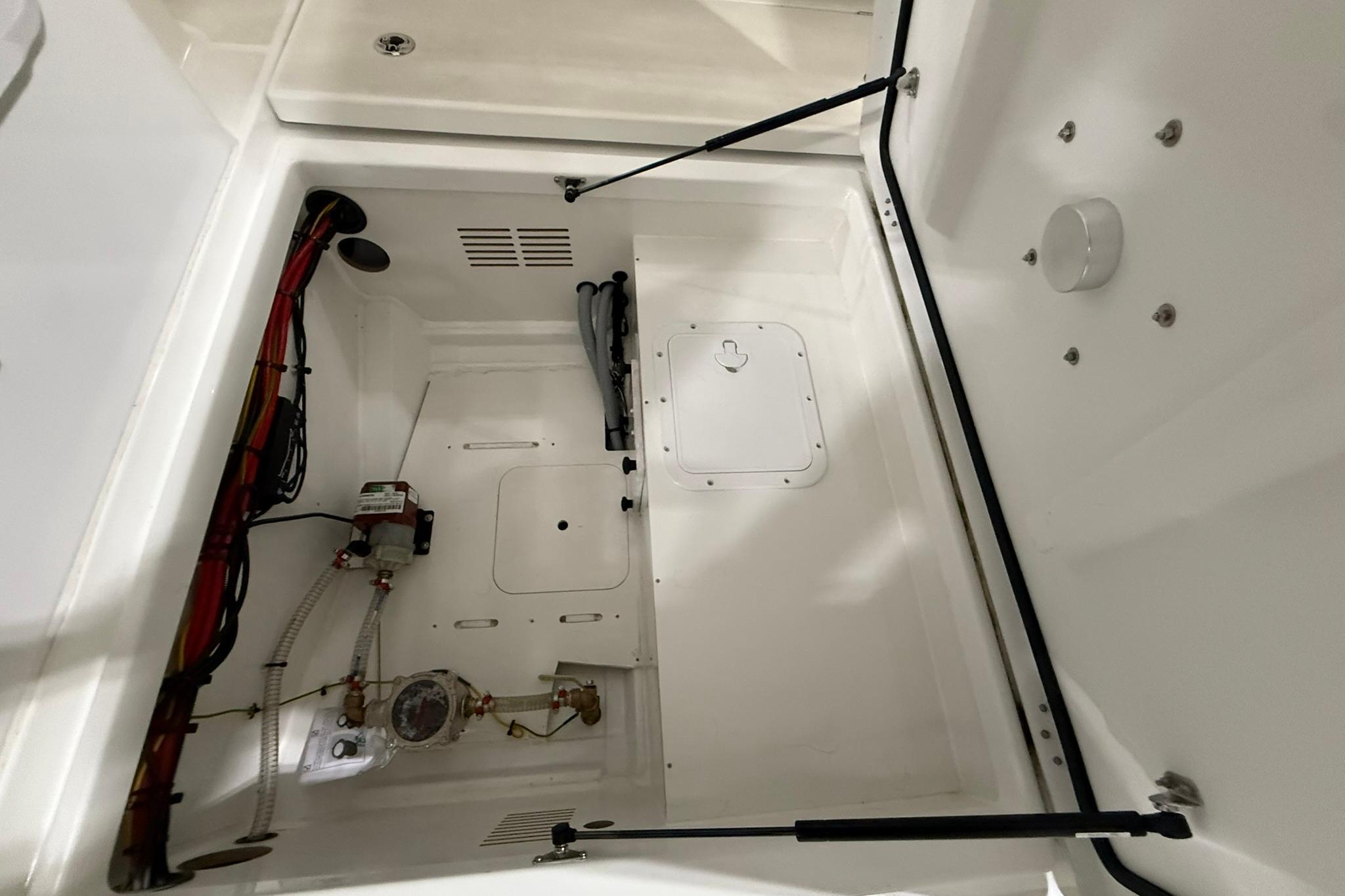 2024 Jeanneau NC Sport 795 Series 2 boat interior compartment with wiring and components.