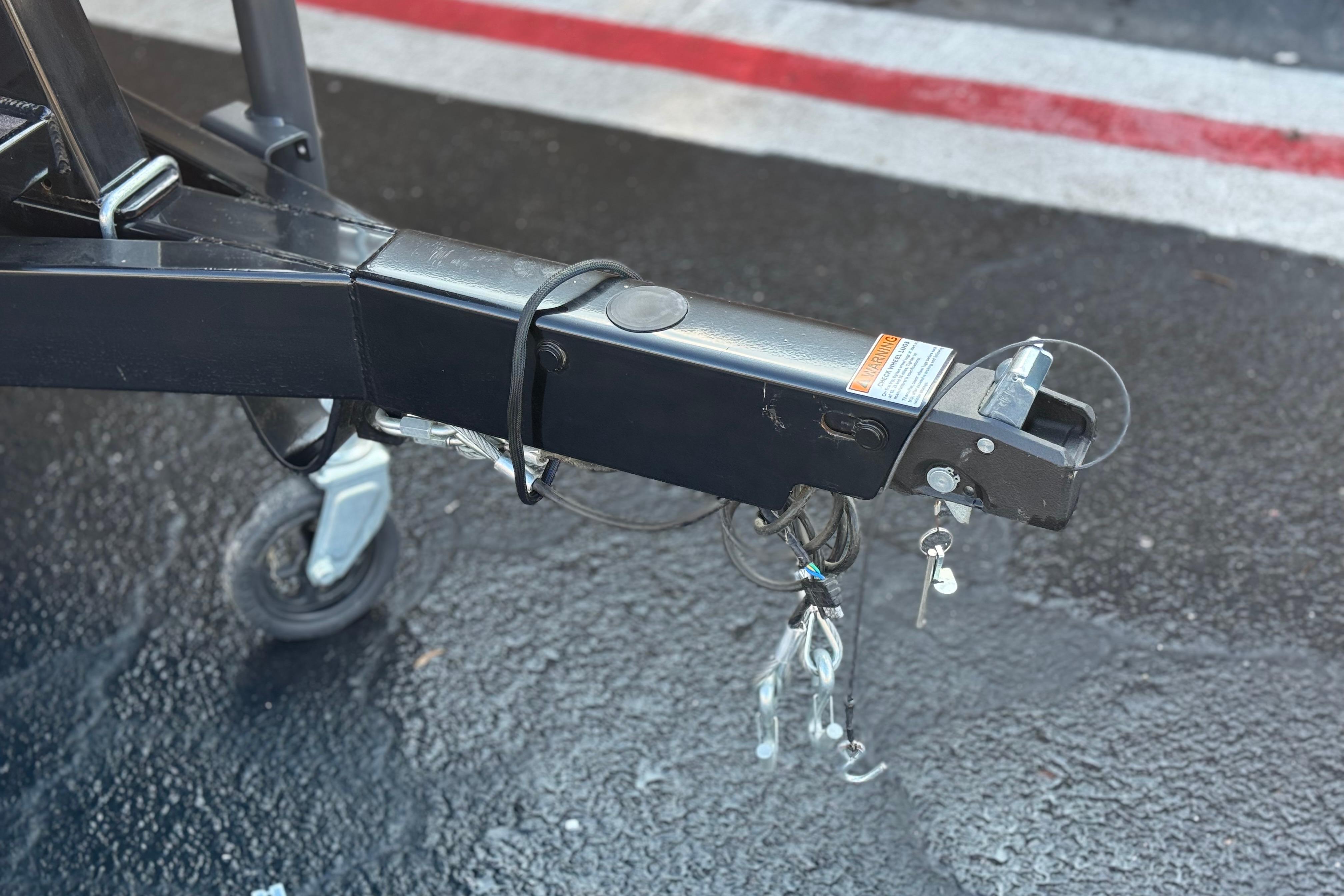 Trailer hitch of 2026 Berkshire 22RFX LE on wet pavement.