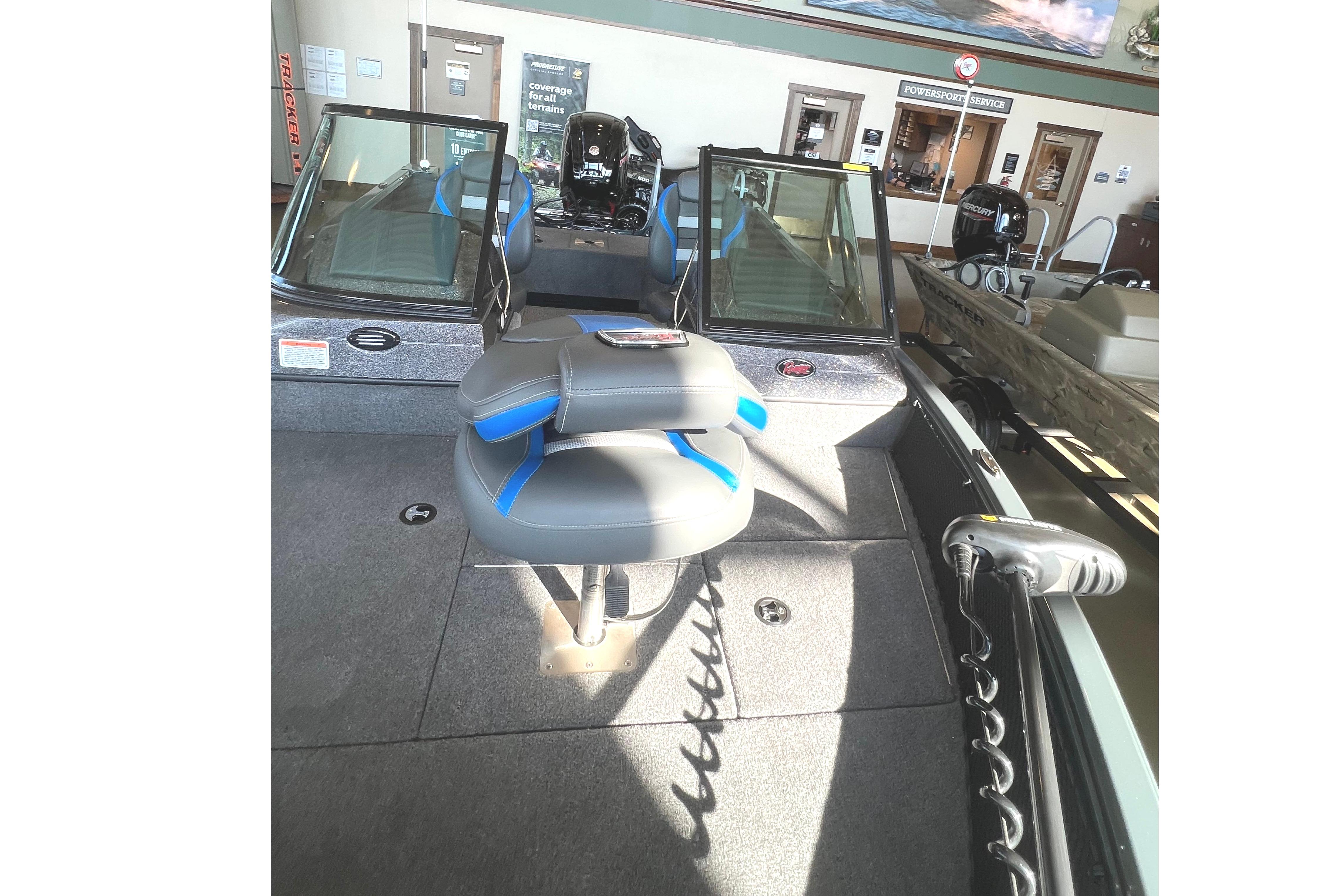 2024 Ranger VS1682SC Angler boat interior in showroom with mounted deer and fishing decor.