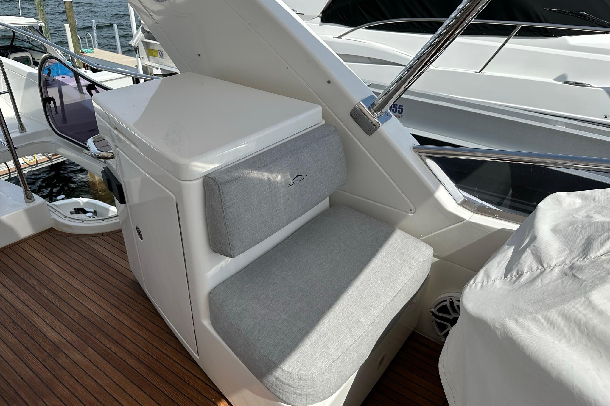 Azimut Fly 53 yacht interior, featuring cushioned seating and sleek design, 2013 model.