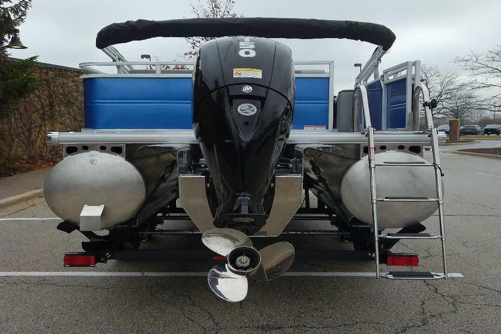 2026 Sun Tracker Party Barge 22 RF XP3 pontoon boat rear view with motor and ladder.
