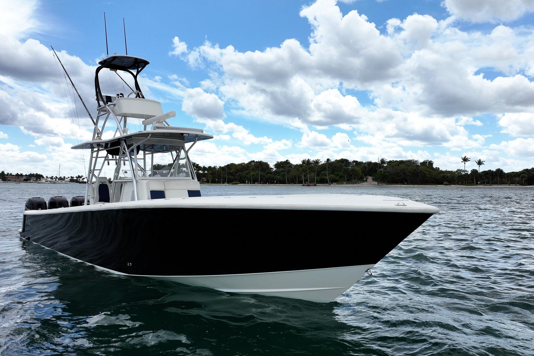 2022 SeaVee 390Z boat on water under cloudy sky.