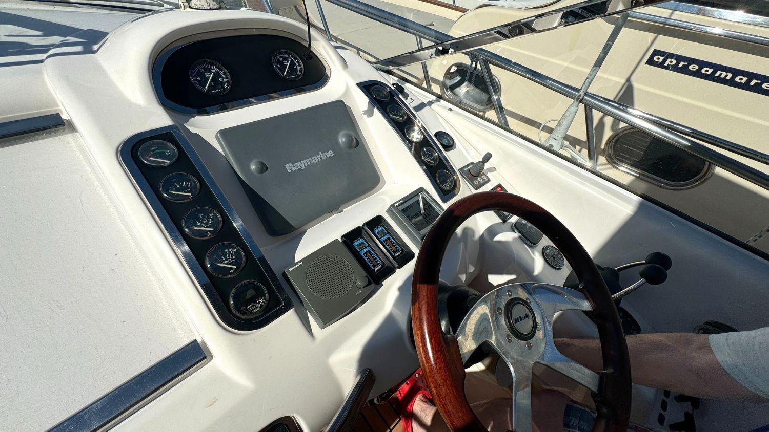 Helm of 2004 Windy 34 Khamsin boat with steering wheel and control panel.