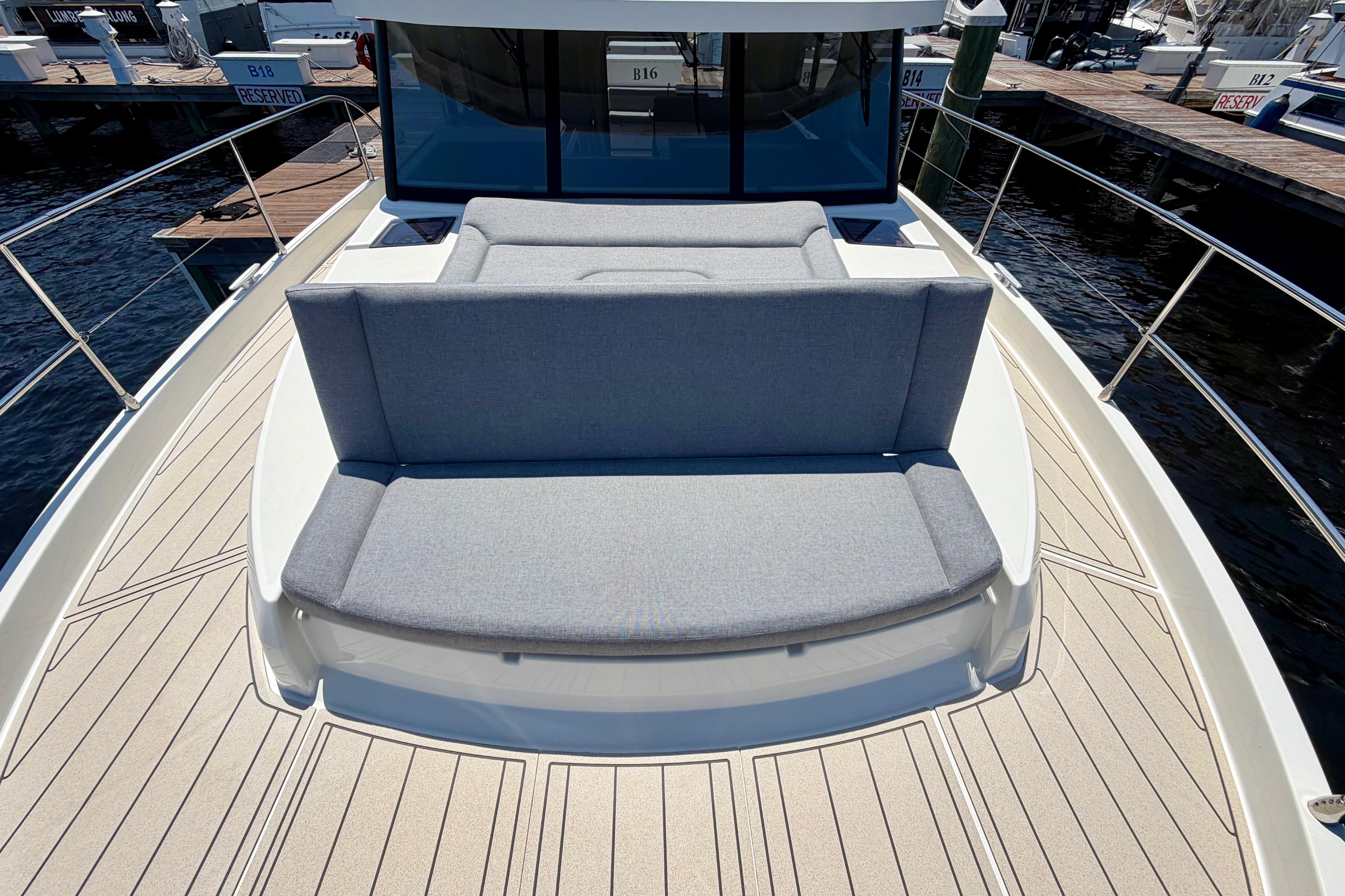 2025 Beneteau Swift Trawler 41 Fly with spacious deck seating at the marina.