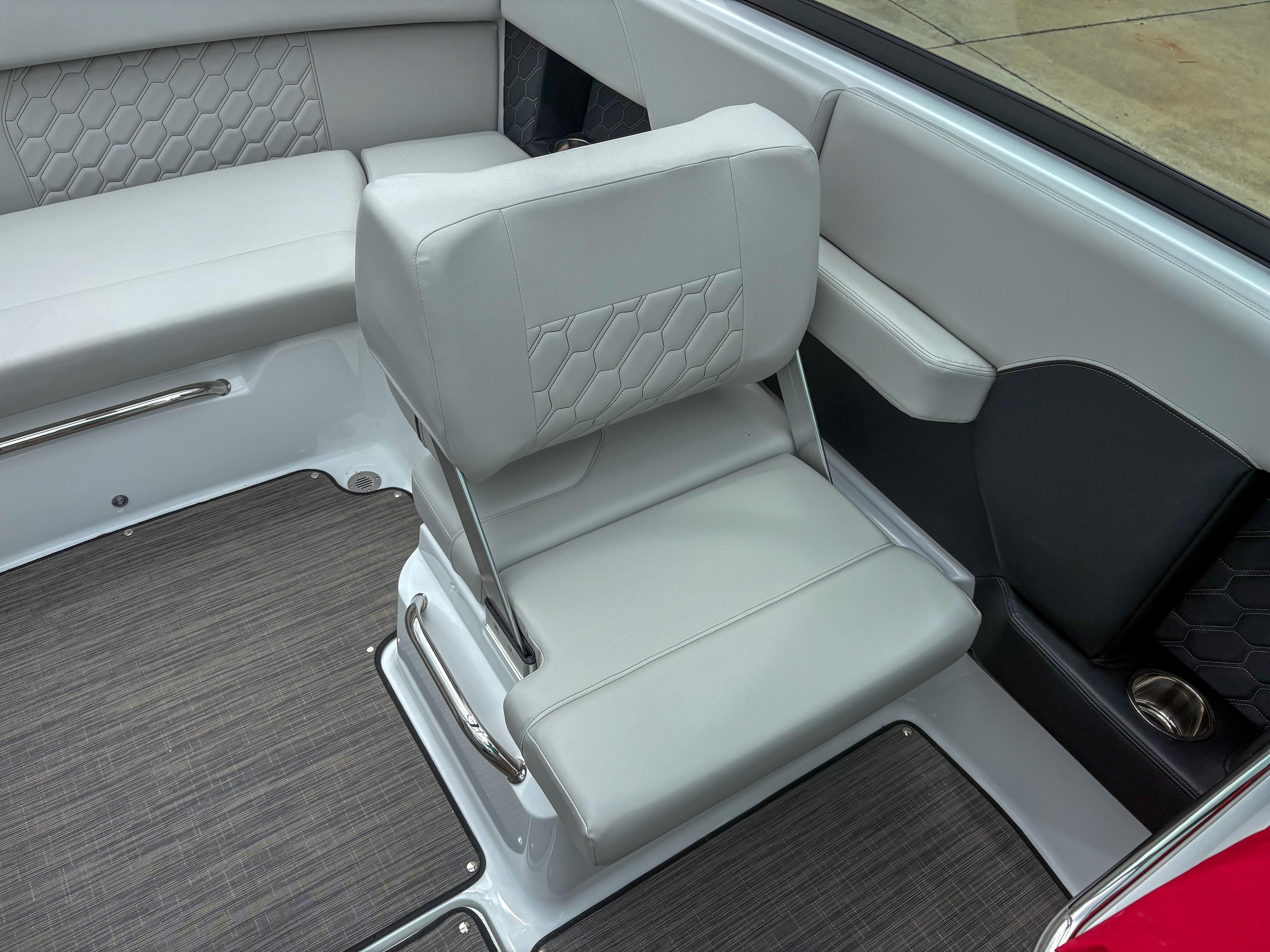 2026 Four Winns H2 Freedom boat interior with gray seating and modern design.