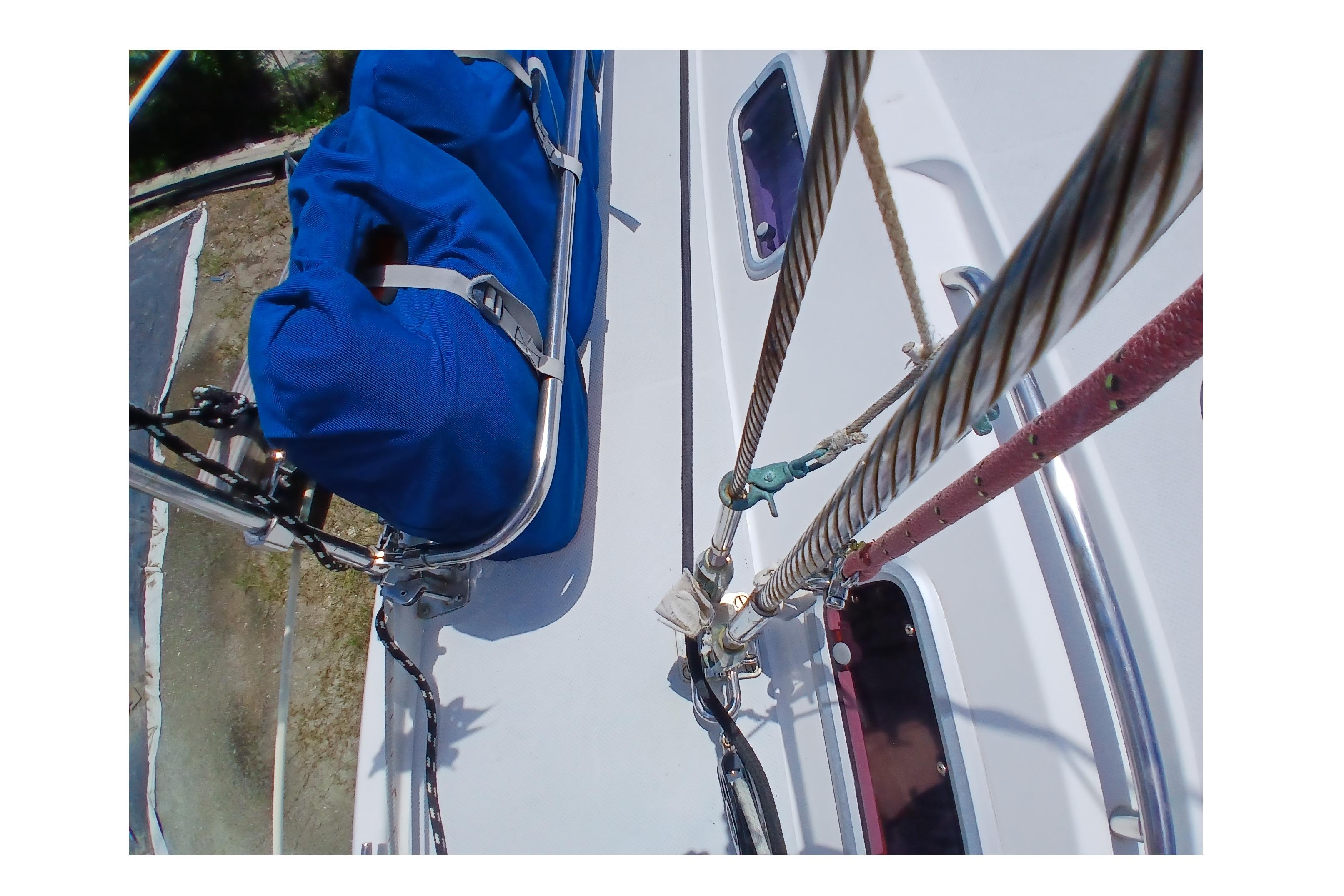 Close-up of Catalina 42 MkII sailboat deck, featuring rigging and blue sail cover.