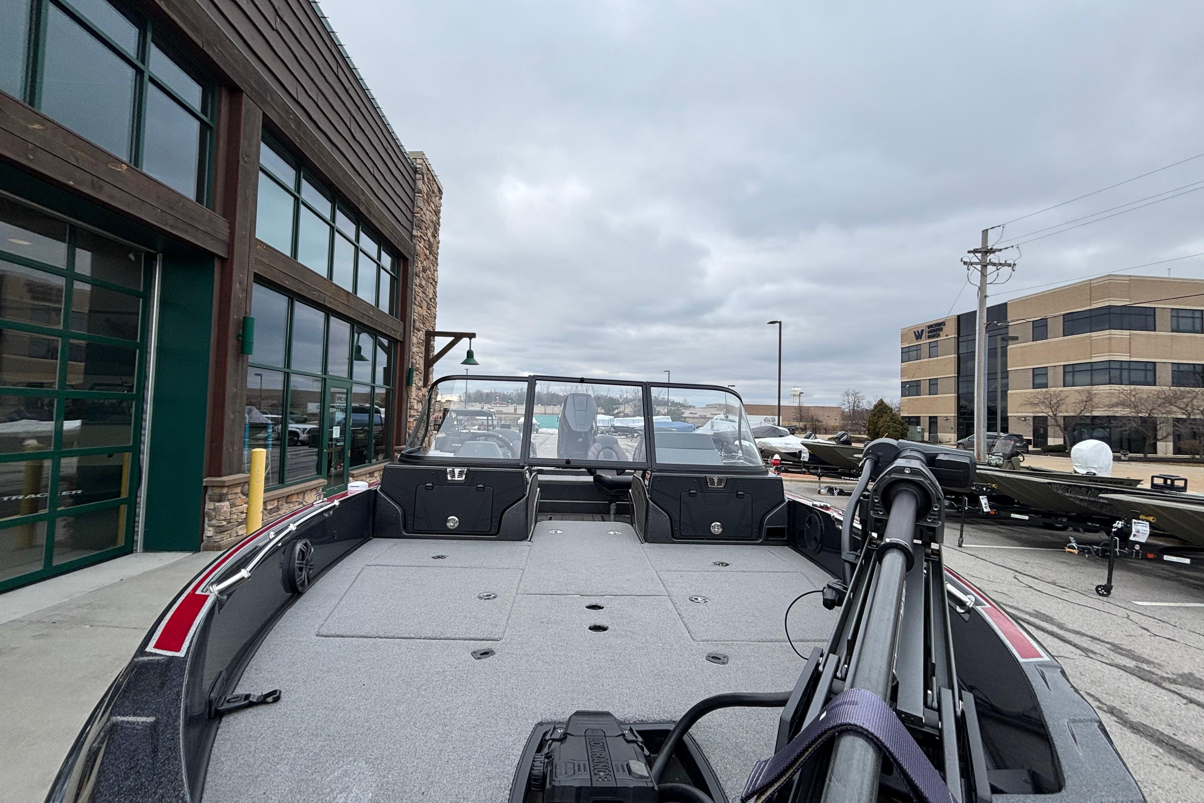 2024 Nitro ZV21 Pro boat displayed outdoors near commercial buildings.