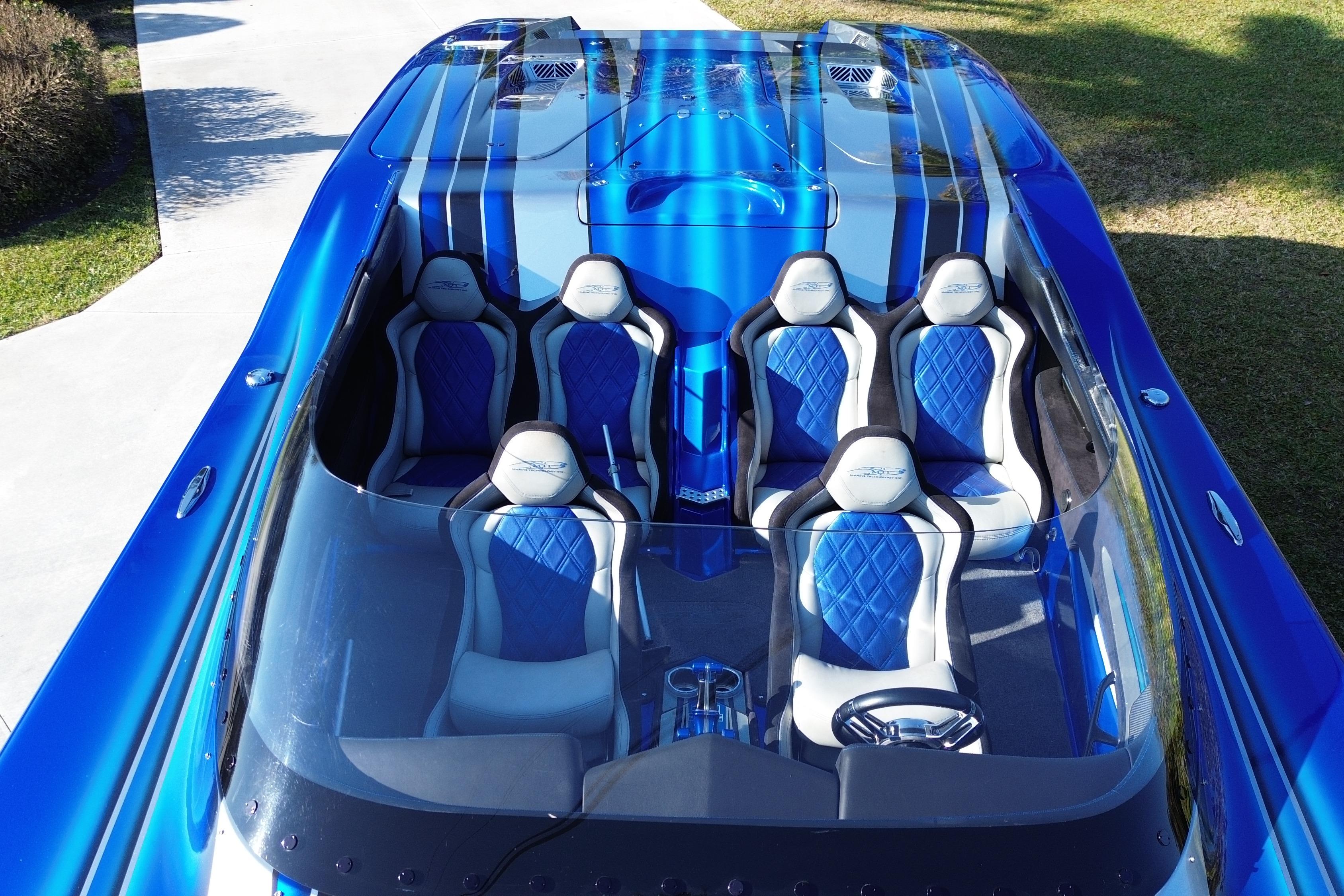 2016 MTI 44 RP speedboat with blue and white seating, aerial view.