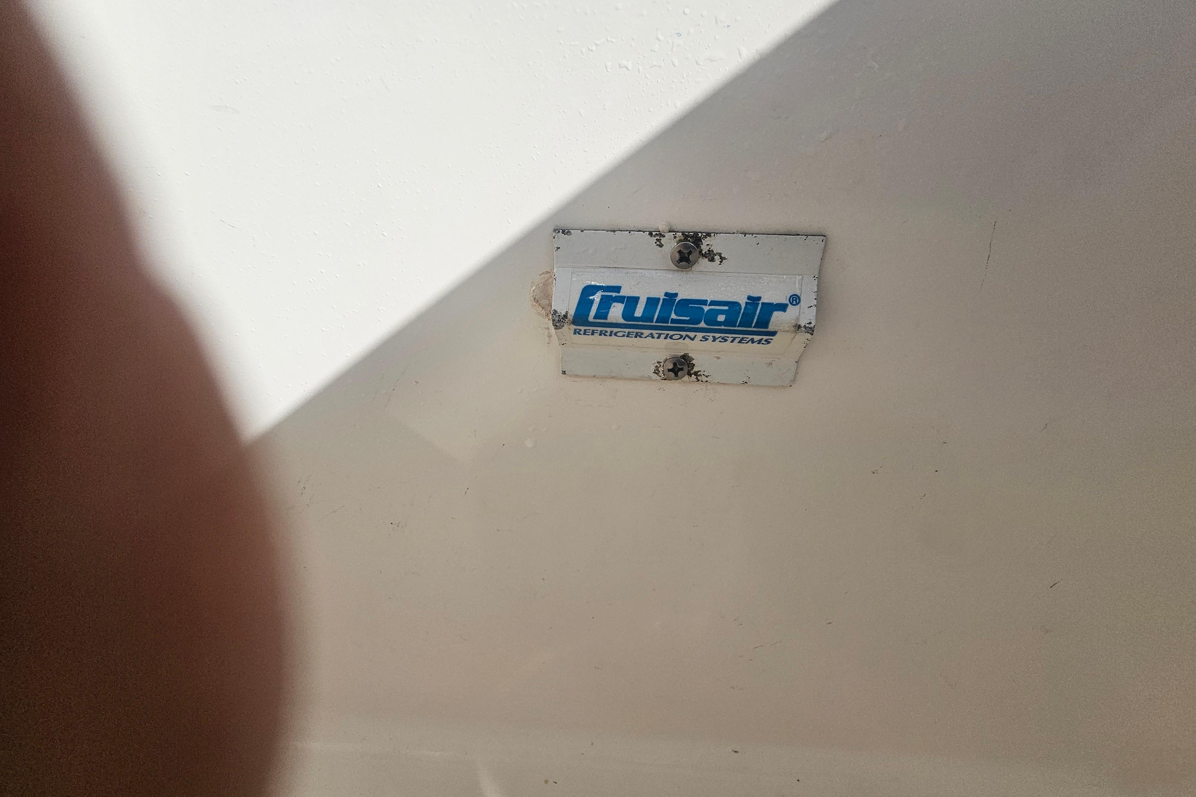 Frigibar refrigeration system label on 2003 Topaz 32 Express boat.