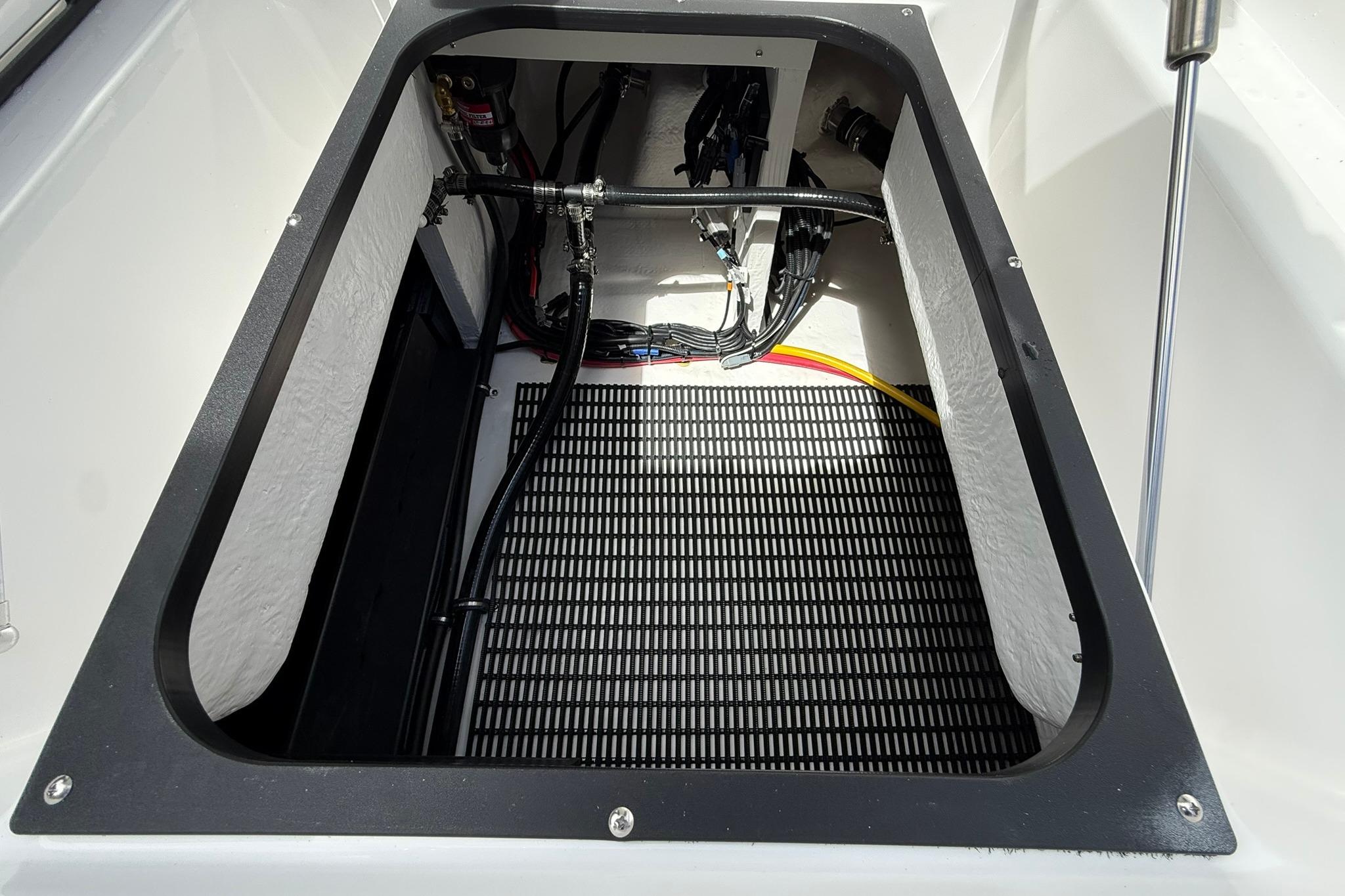 Open compartment of 2027 Monterey Elite 30 OB boat showing internal wiring and components.