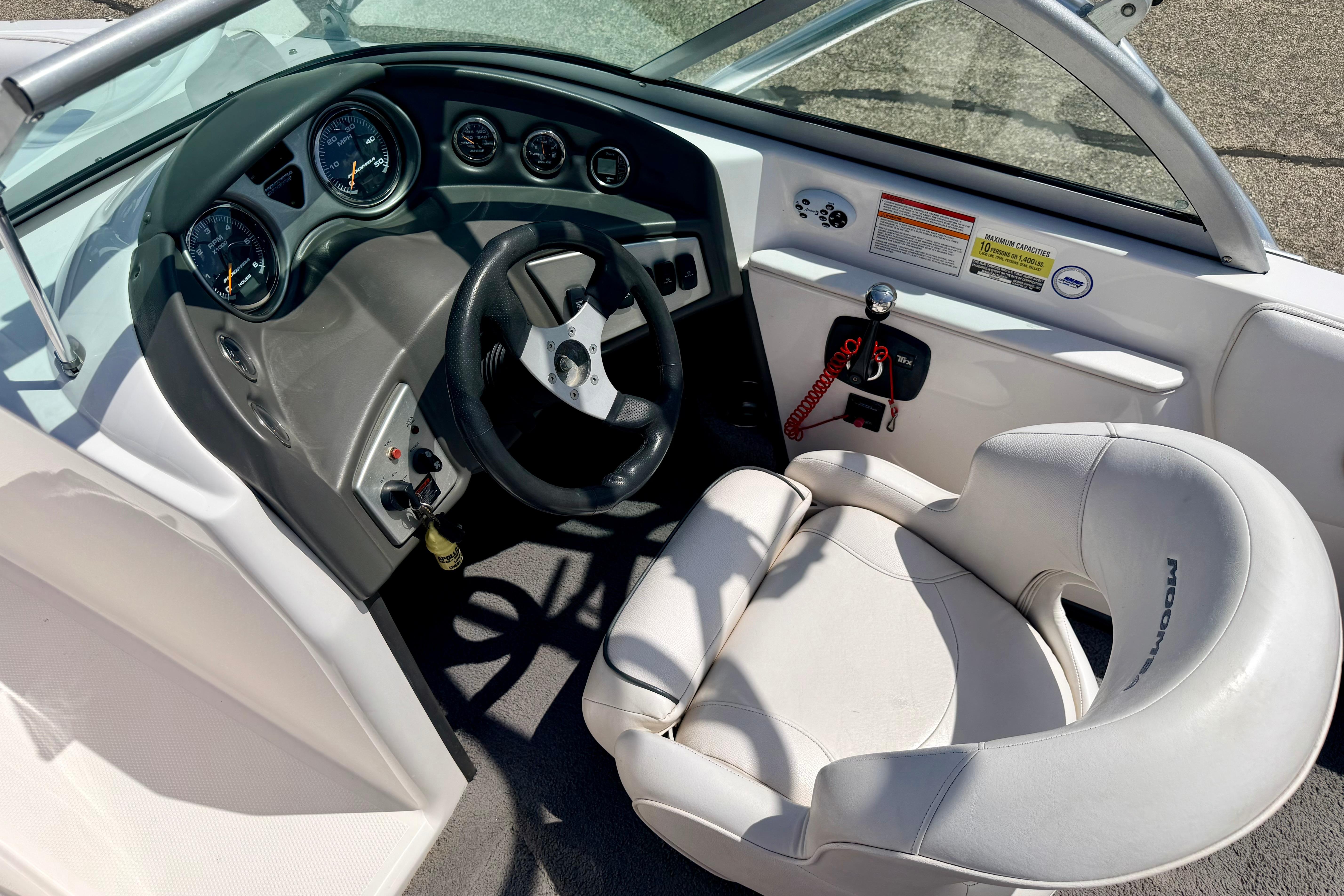 2008 Moomba Outback V boat cockpit with steering wheel and gauges.