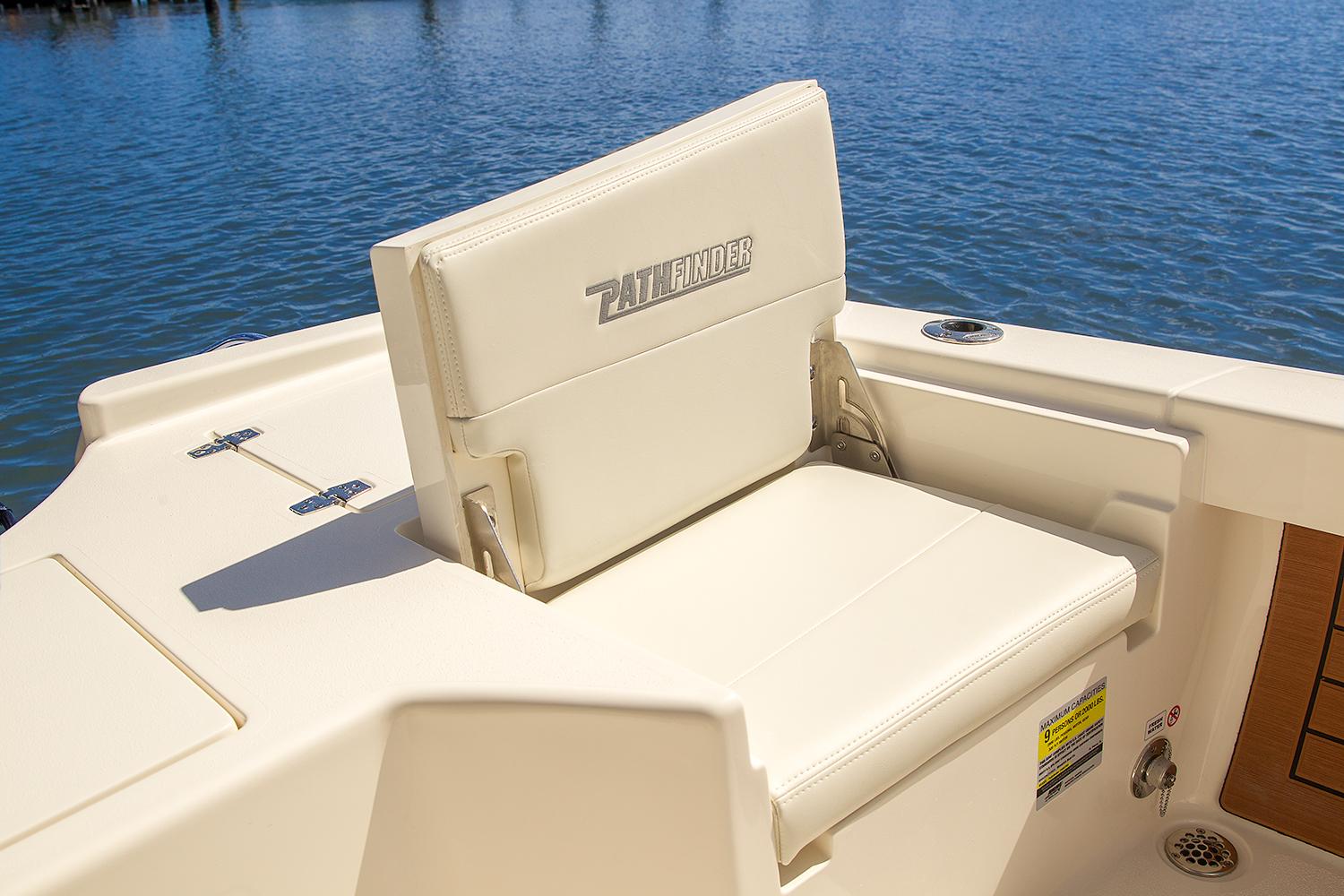 Manufacturer Provided Image: Pathfinder 2500 Hybrid 2026 boat seat, cream color, on calm water background.