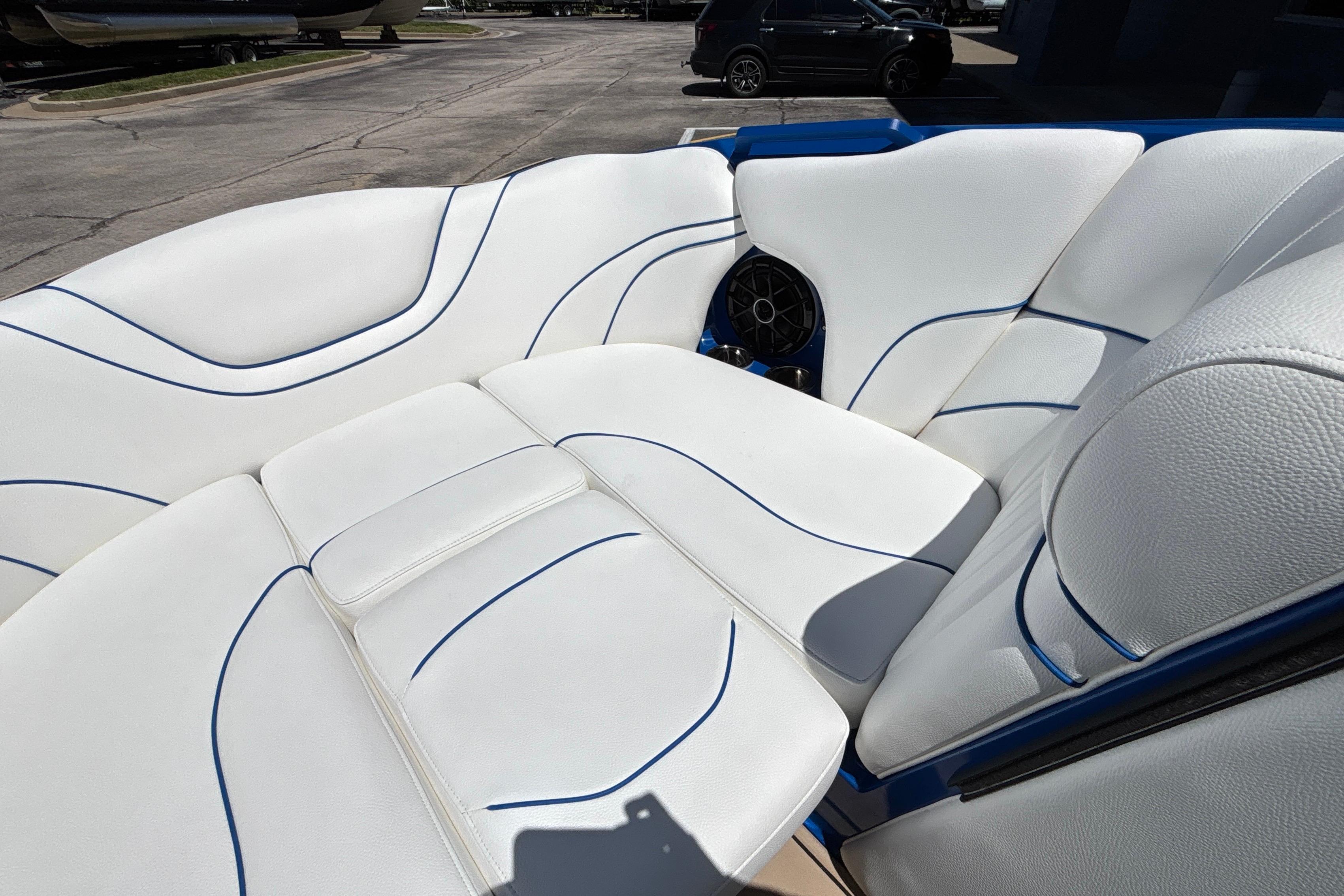 Luxurious white seating with blue accents in a 2026 MB B52 23 Alpha boat.