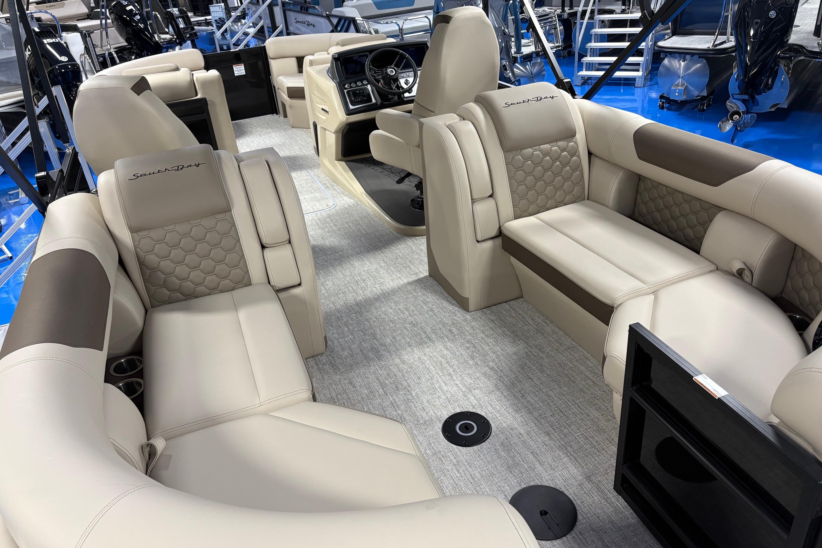 Luxurious interior of 2026 South Bay 523RS pontoon boat with plush seating and modern design.