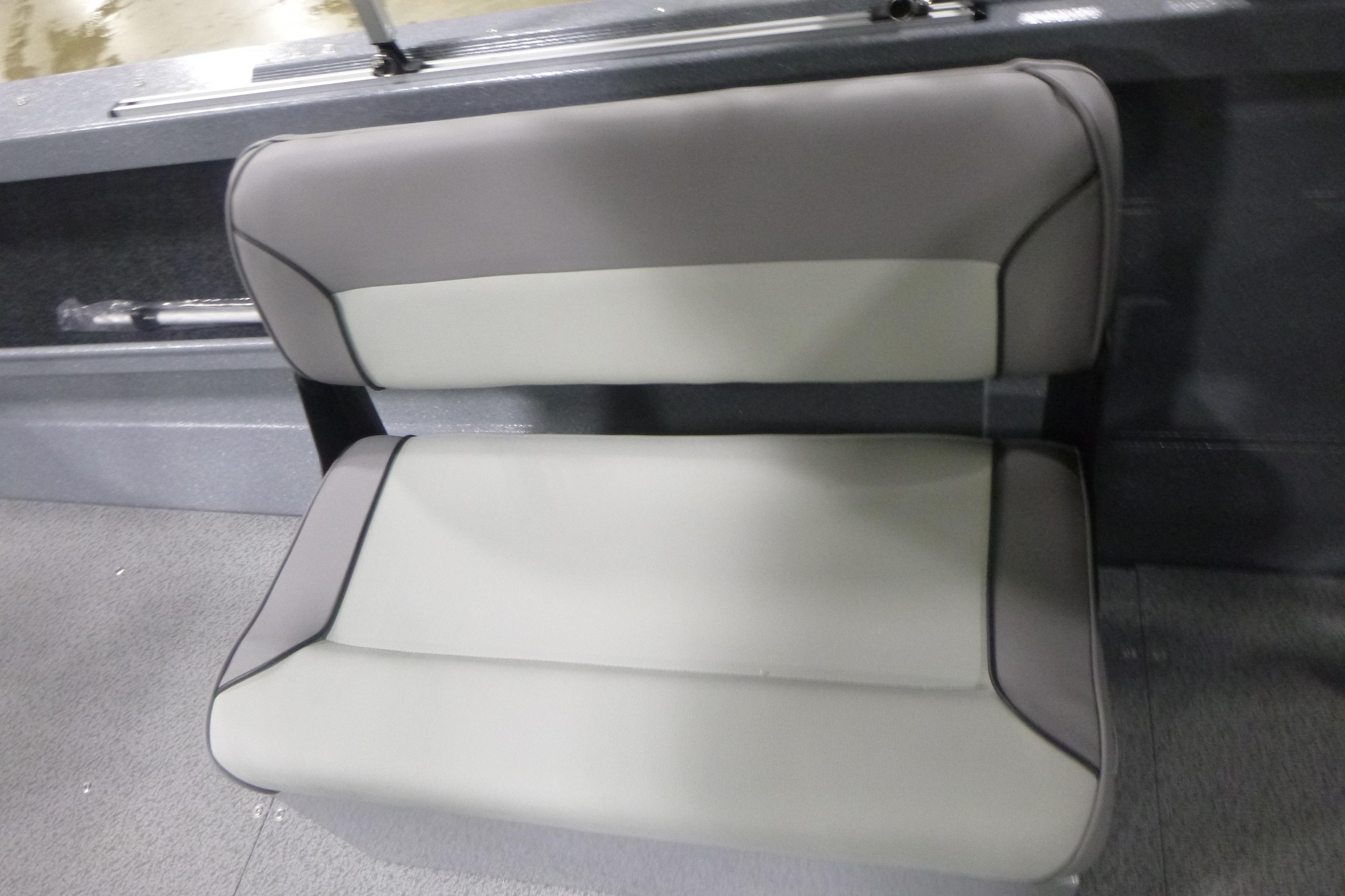 Gray and white seat in 2026 KingFisher 2025 Falcon boat interior.