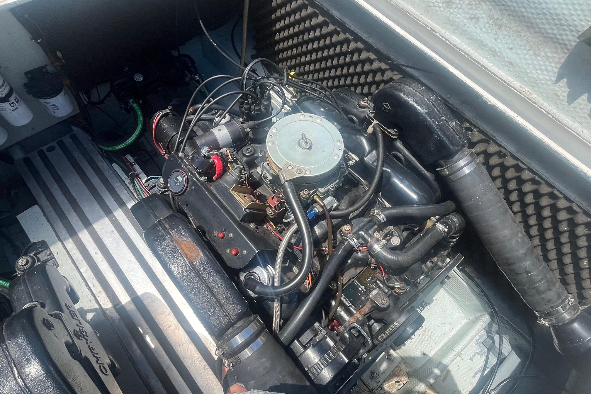 Engine compartment of a 1988 Seafox 29 Flybridge boat, showcasing detailed mechanical components.