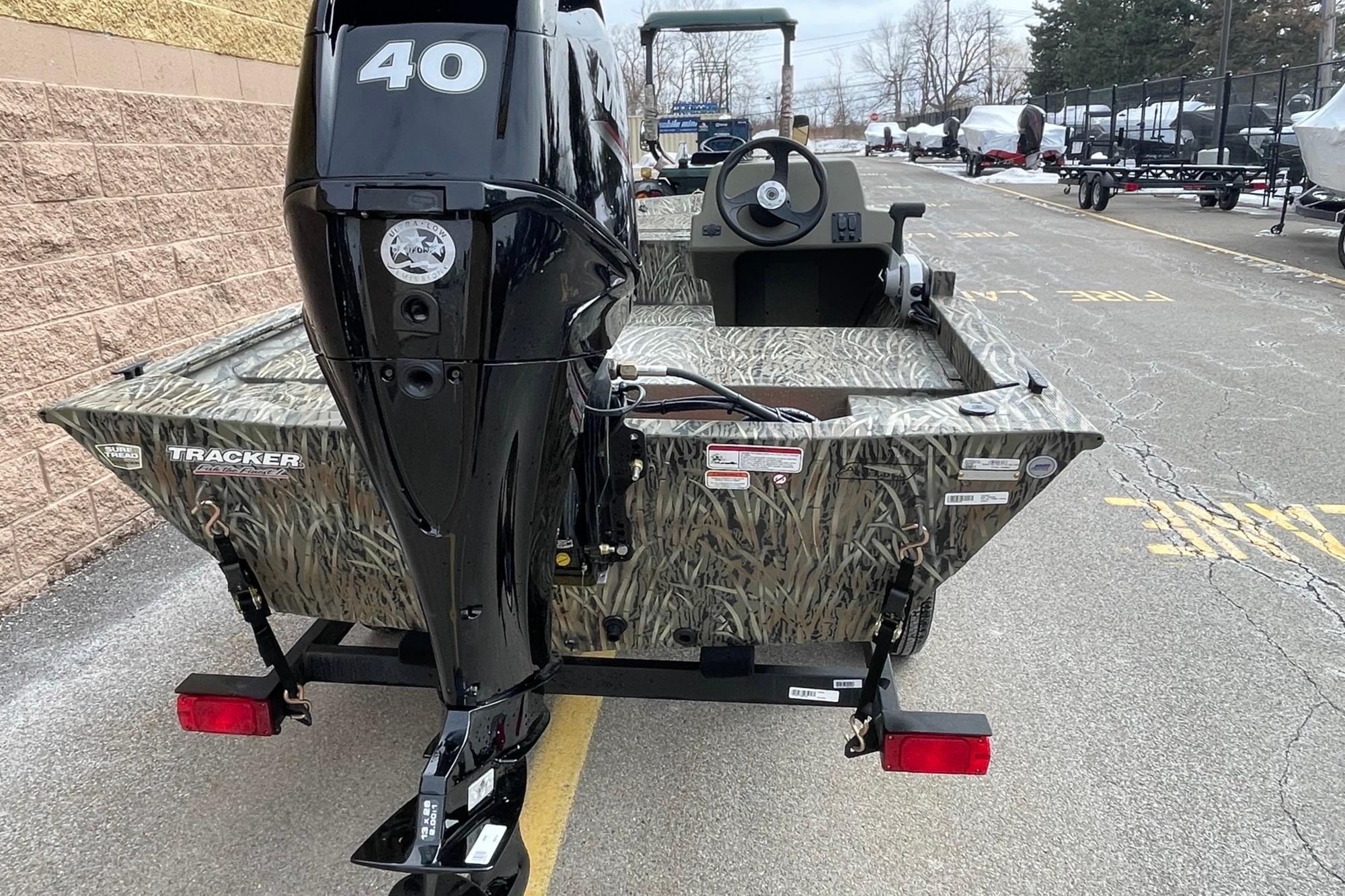 2026 Tracker Grizzly 1648 SC boat with camouflage design and 40 HP motor.