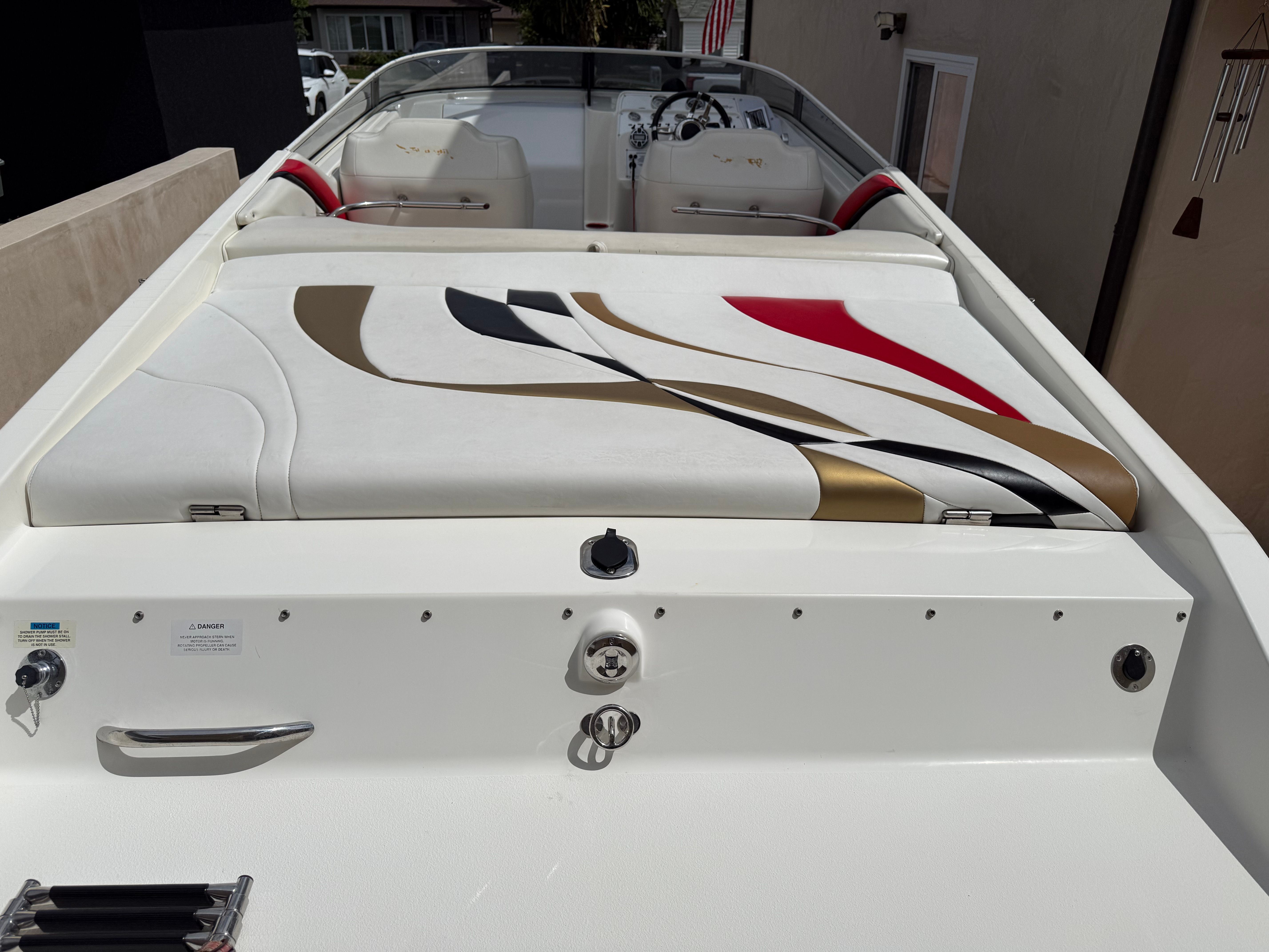Interior of a 2001 Wellcraft 29 Scarab boat with colorful seat design.