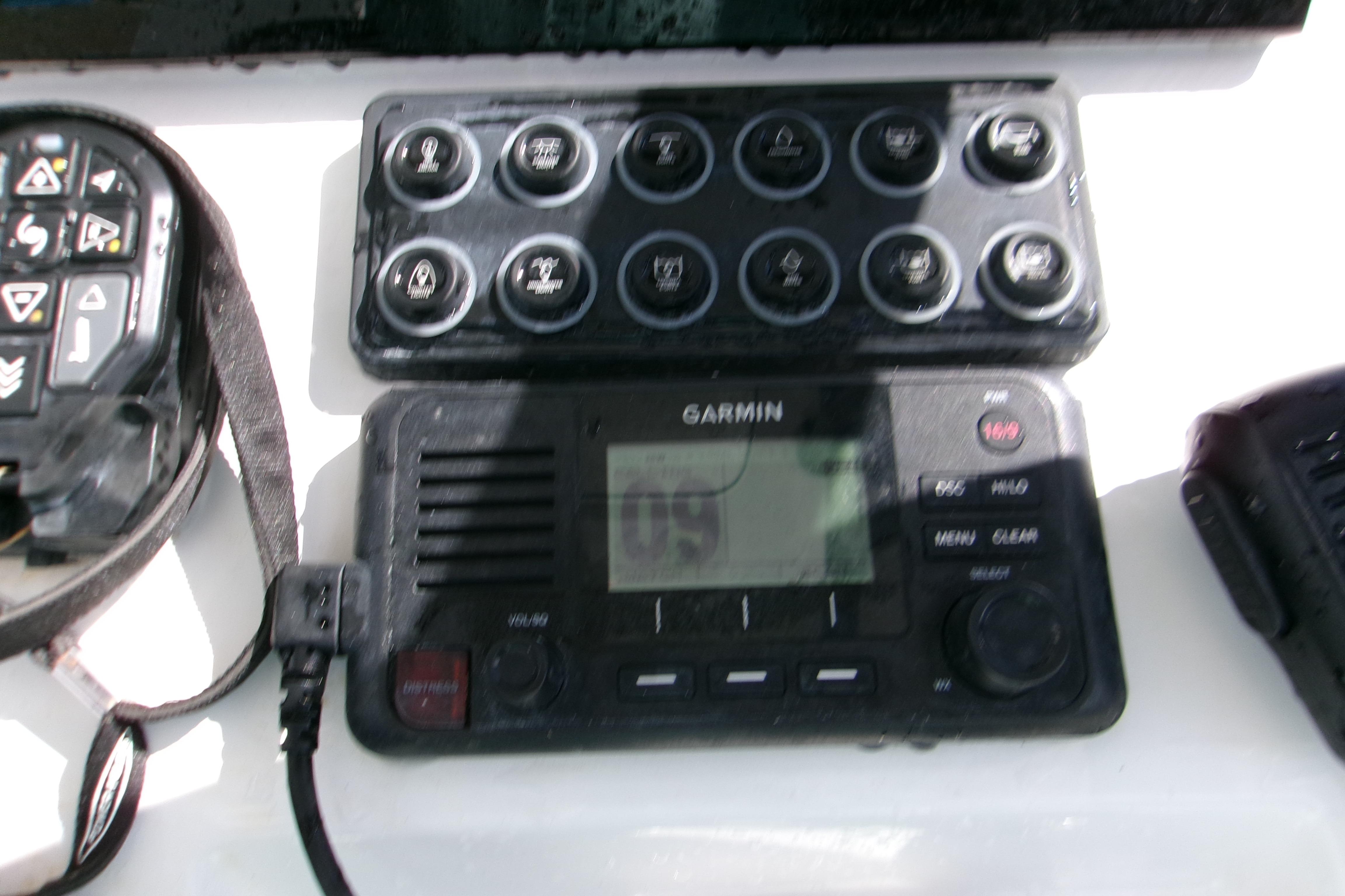 Control panel and Garmin device on 2024 Sportsman Masters 227 Bay Boat dashboard.