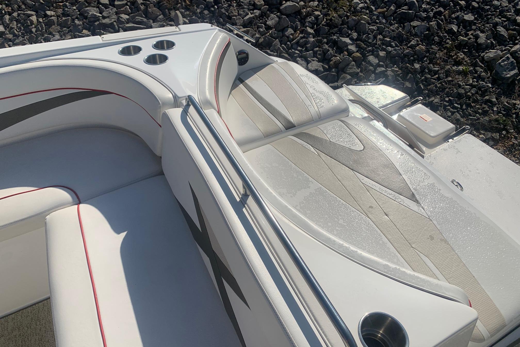 2006 Rinker 282 Captiva Cuddy boat interior with stylish seating and cup holders.