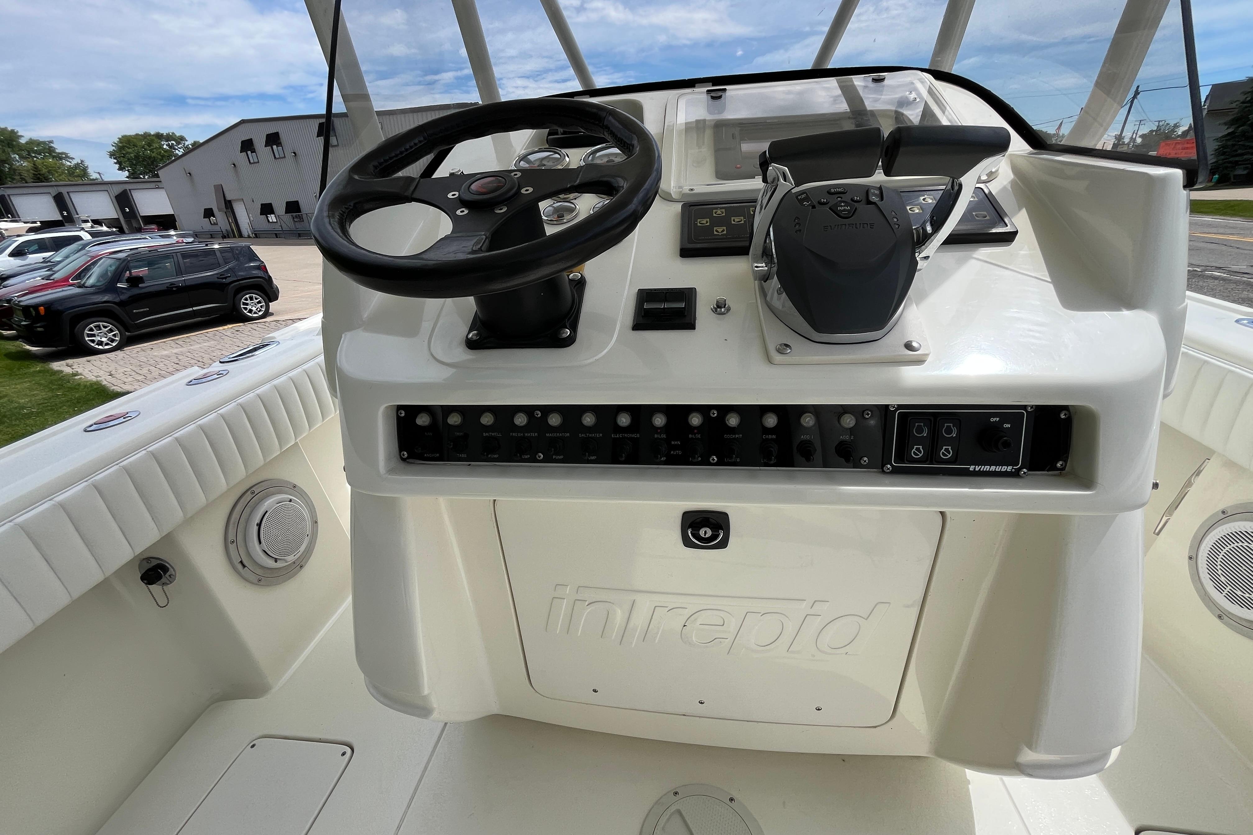 1994 Intrepid 30 Open Cuddy boat helm with steering wheel and control panel.