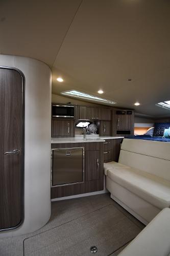 2021 Regal 35 Sport Coupe interior with modern kitchen and seating area.