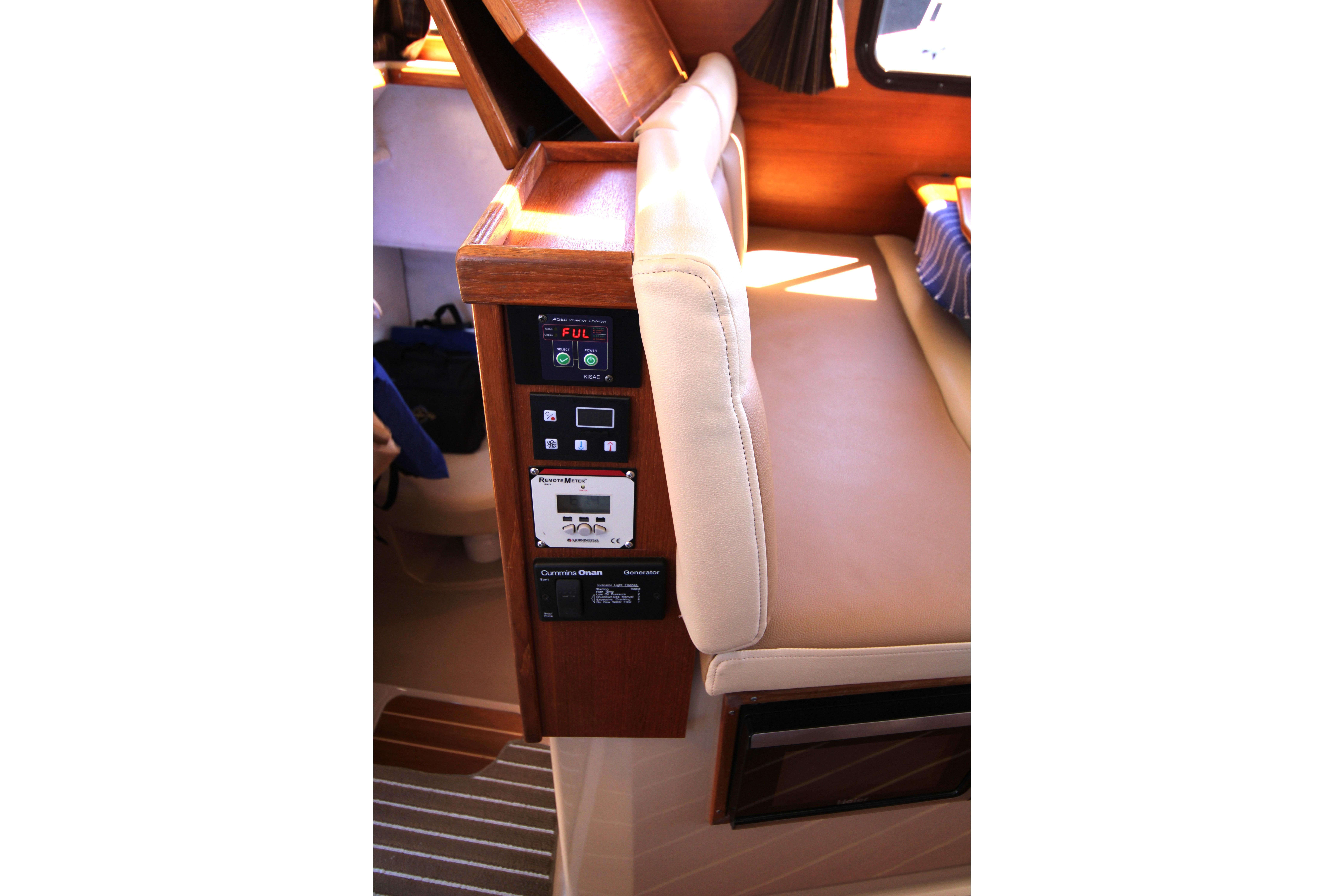 Interior view of a 2013 Ranger Tugs R-31 CB boat, featuring control panels and seating.
