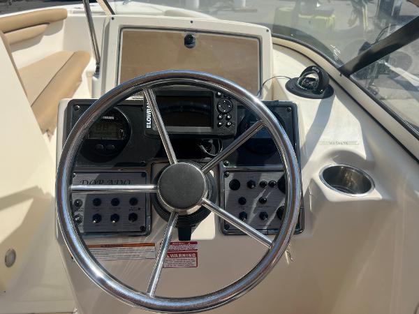 2019 Scout 210 Dorado boat dashboard with steering wheel and control panel.