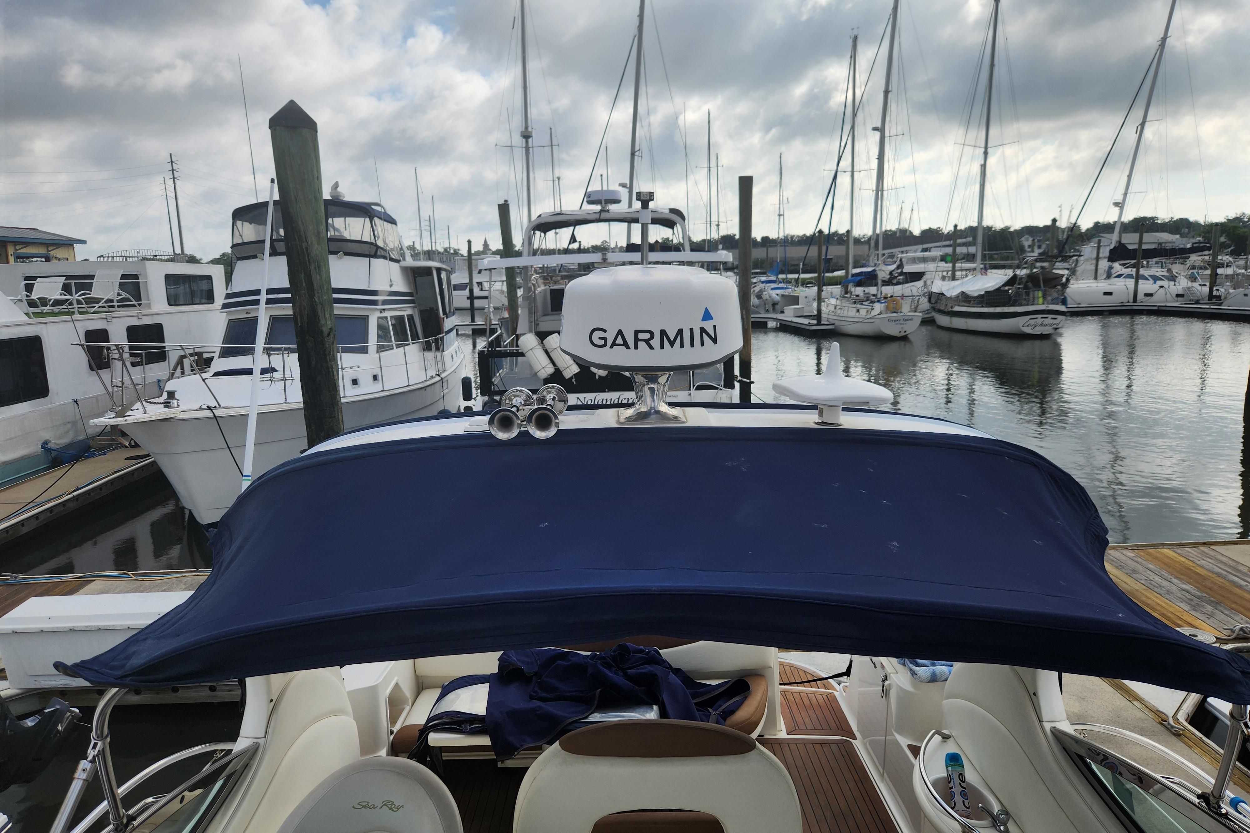 2003 Sea Ray 360 Sundancer docked at marina with Garmin equipment.