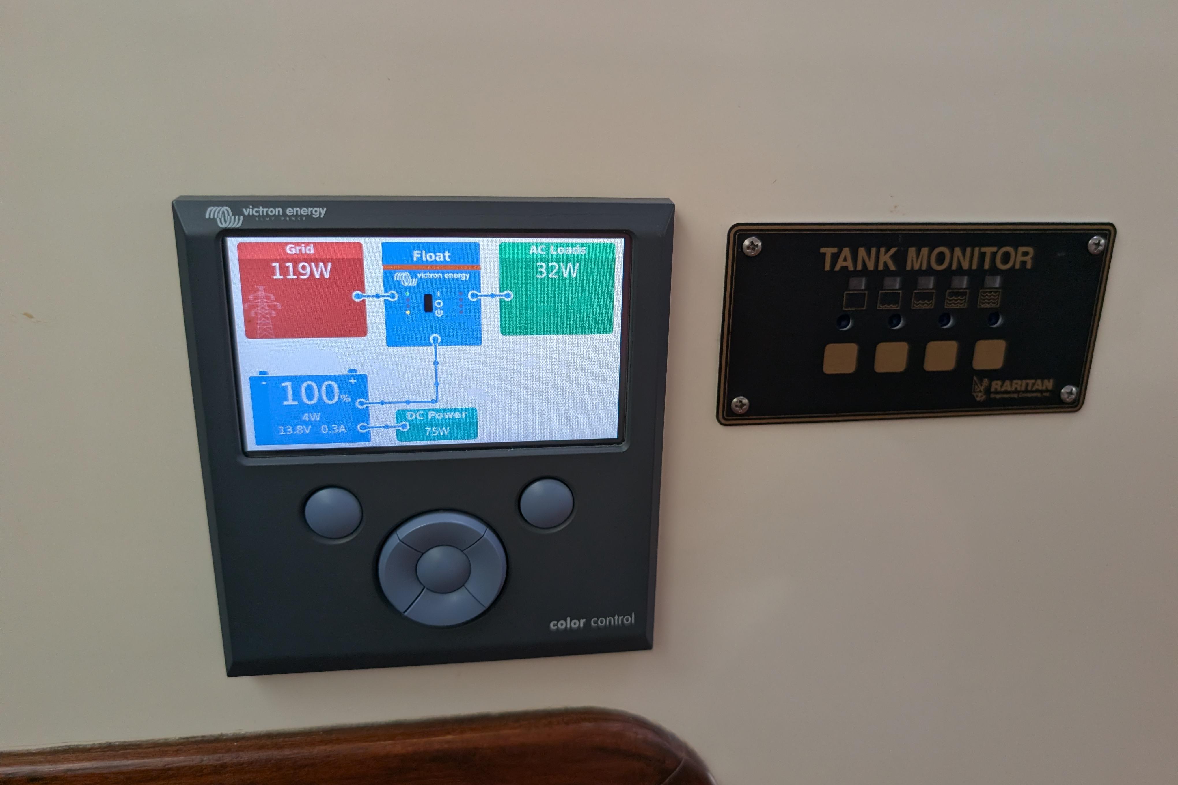 Control panel on Island Spirit 37 yacht, displaying energy and tank monitoring systems.