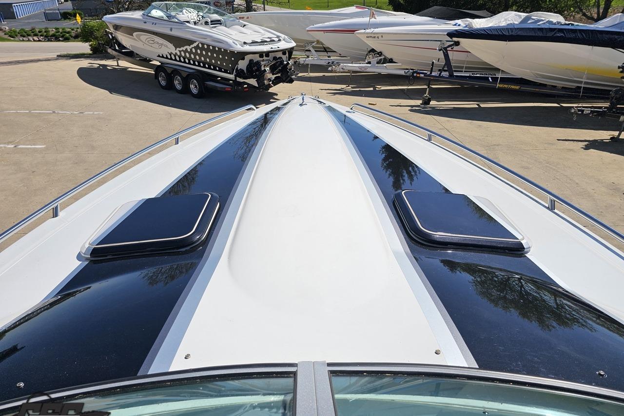 2014 Formula 292 FASTech boat deck with sleek design, parked among other boats.